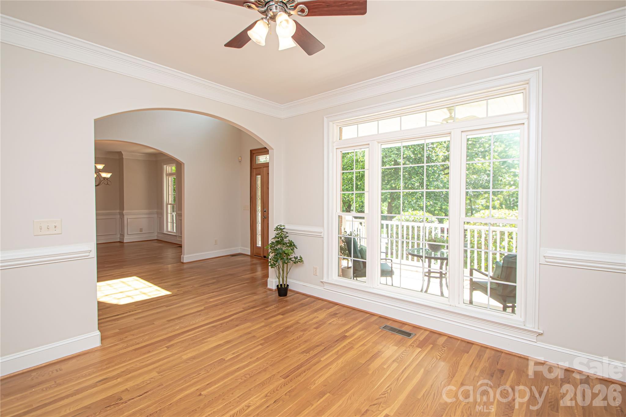 Office has large windows that provide natural light. - 1015 Estate Lane, Matthews