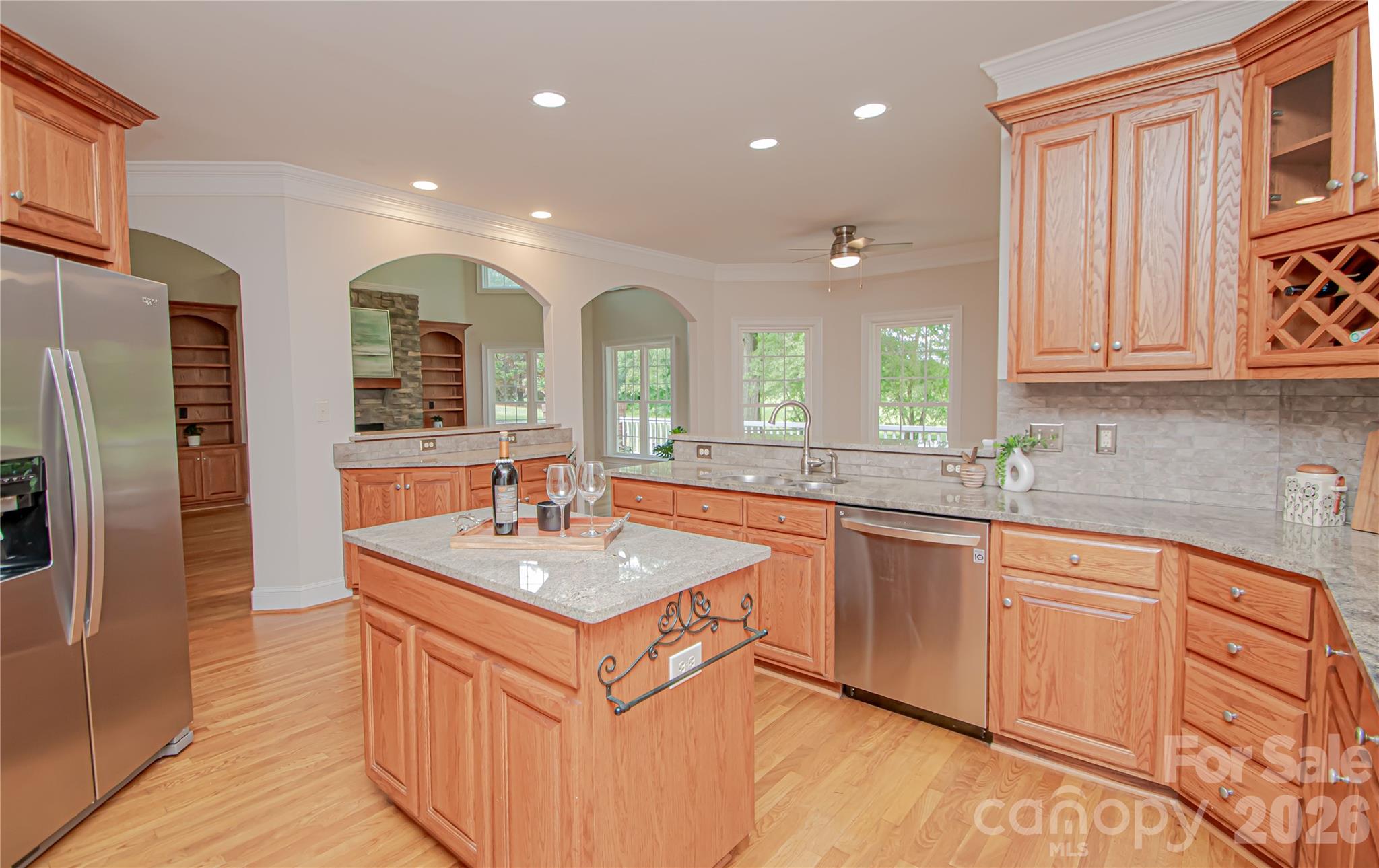 Kitchen has stainless steel appliances, double oven, granite countertops and gas stove. - 1015 Estate Lane, Matthews