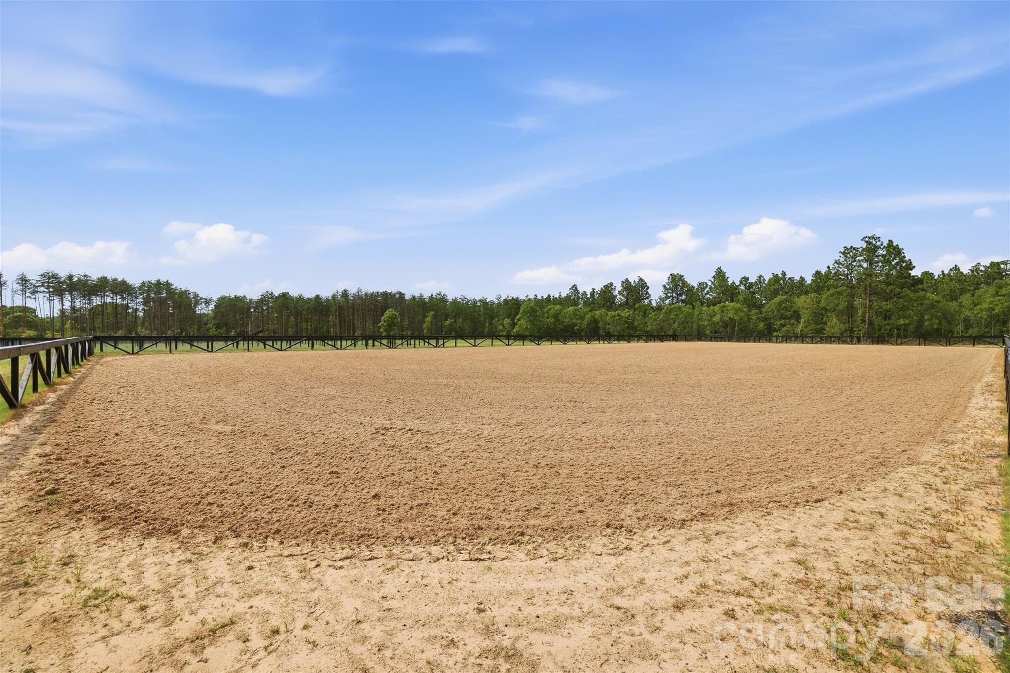 Expansive riding arena provides the perfect setting for training, lessons, and everyday riding. - 8520 Stock Horse Trail, Windsor