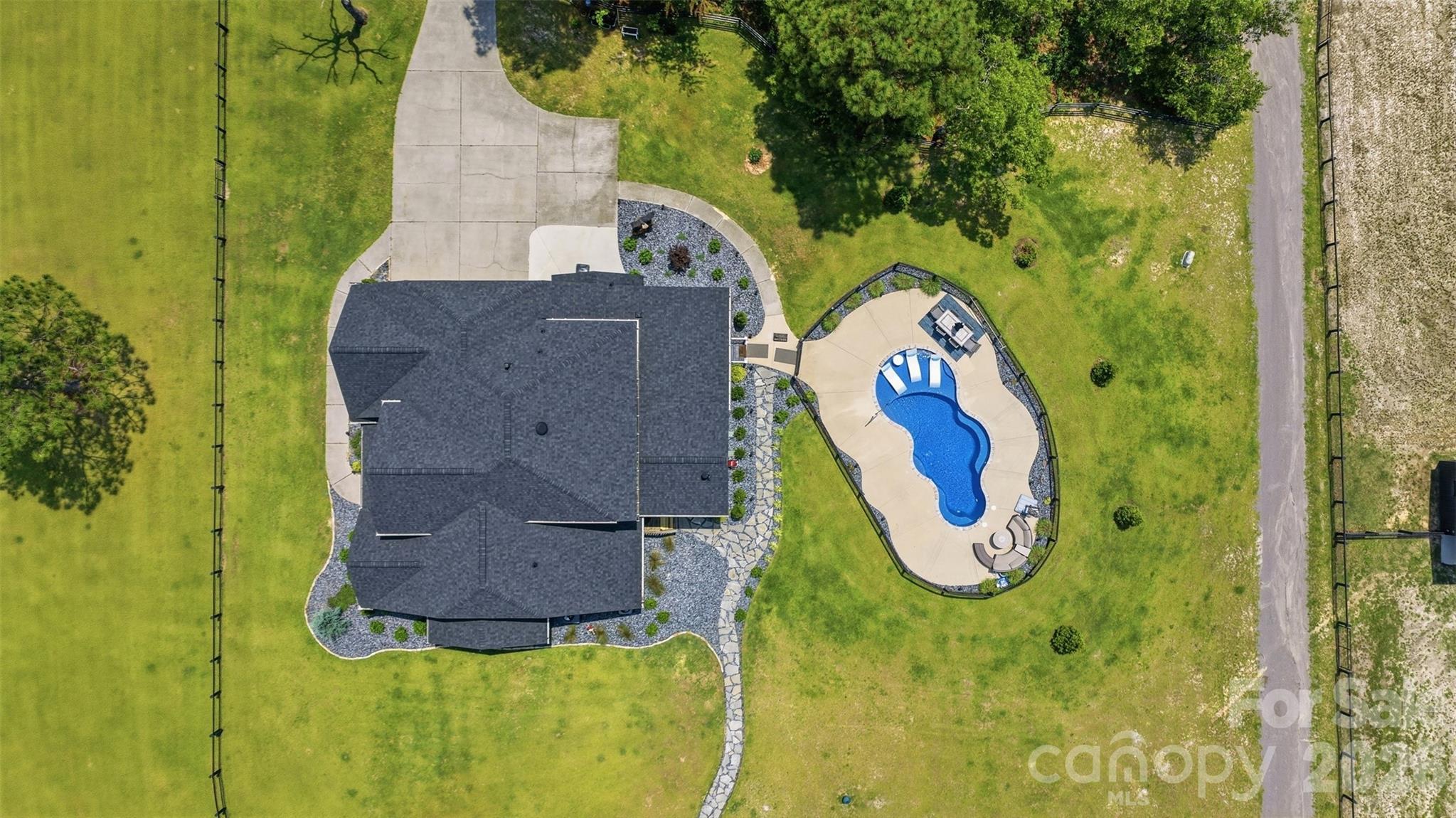 Aerial view of the home and pool - 8520 Stock Horse Trail, Windsor