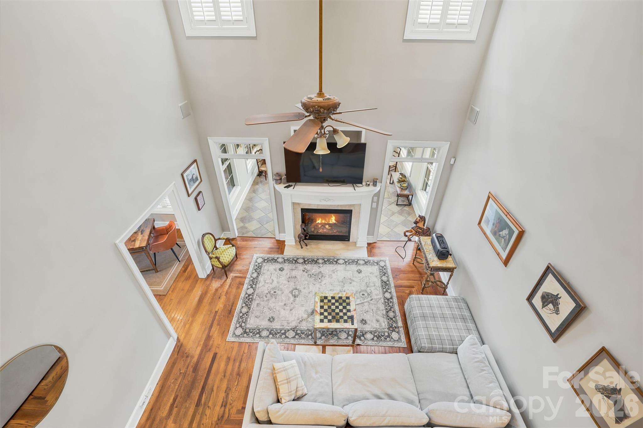 Soaring ceilings and abundant natural light create a dramatic and welcoming first impression. - 8520 Stock Horse Trail, Windsor