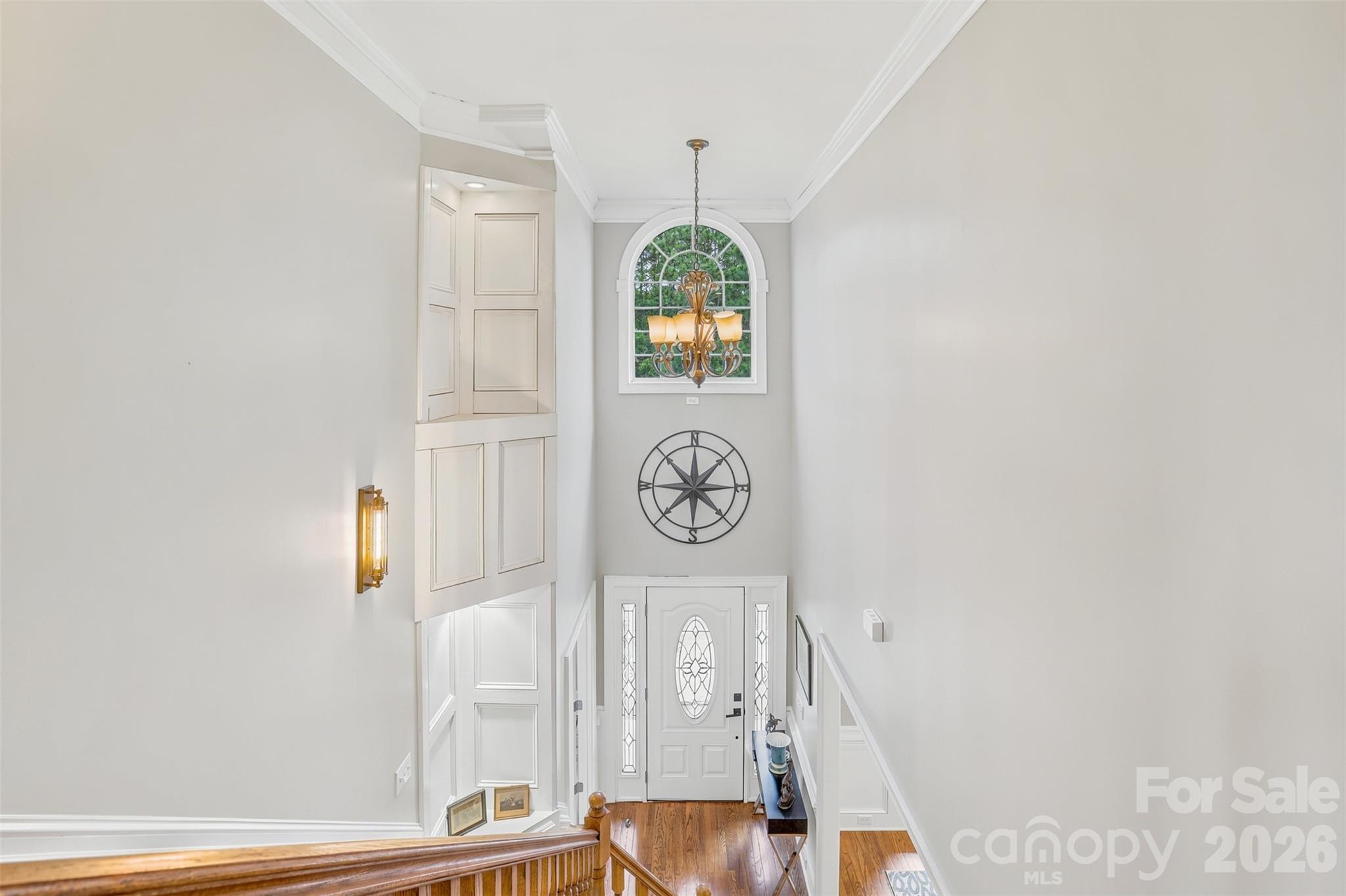 Elegant entryway welcomes guests with abundant natural light and timeless architectural details. - 8520 Stock Horse Trail, Windsor