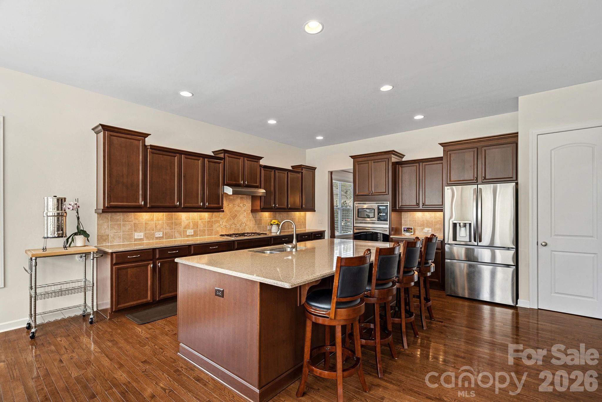 Check out all the cabinets...huge pantry! - 10654 Rippling Stream Drive NW, Concord