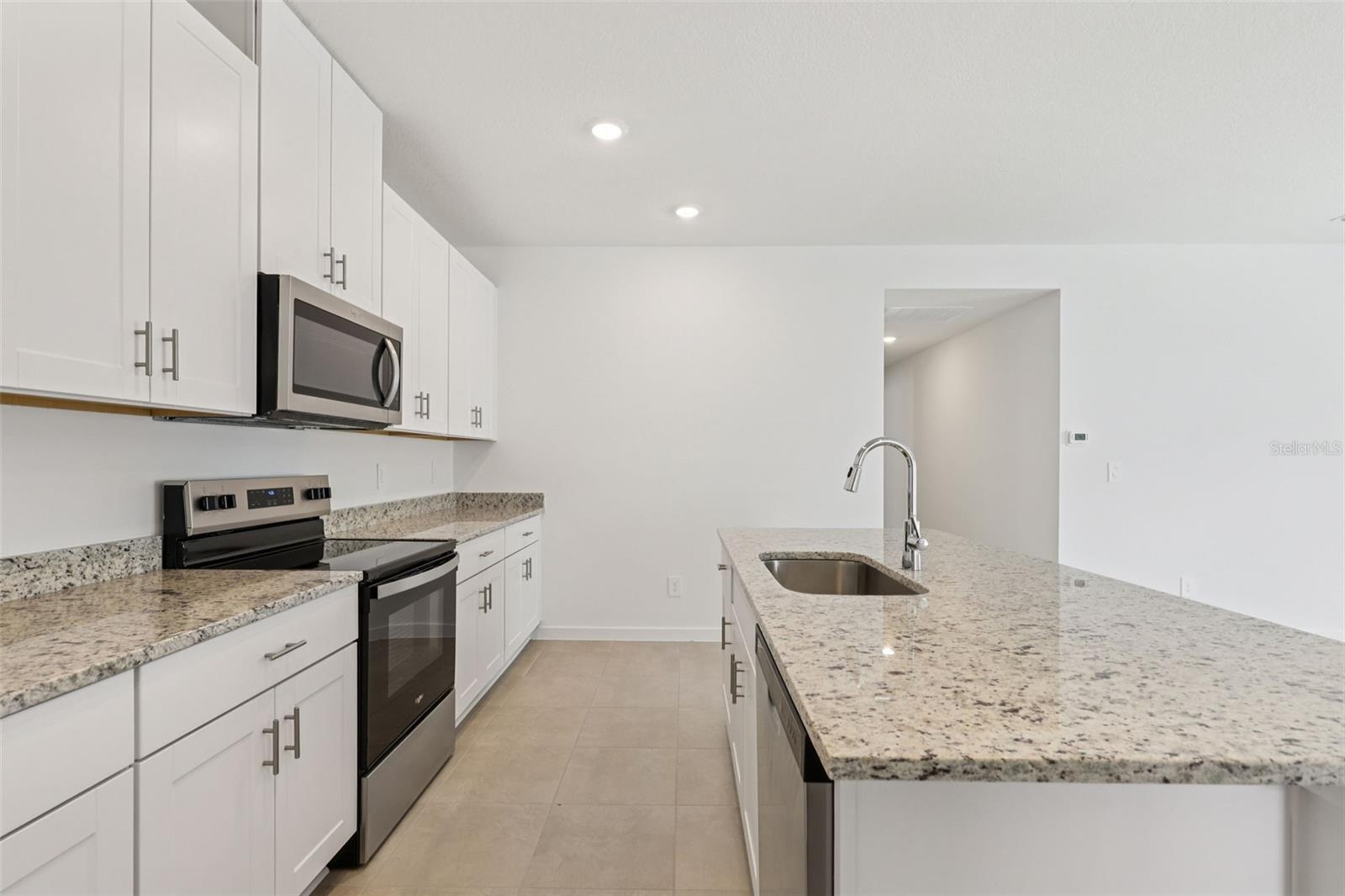 Photo is not of the actual home, but is an inspirational photo of builder’s model home and may depict options, furnishings, and/or decorator features that are not included. - 78 WANDERING CREEK WAY, PALM COAST