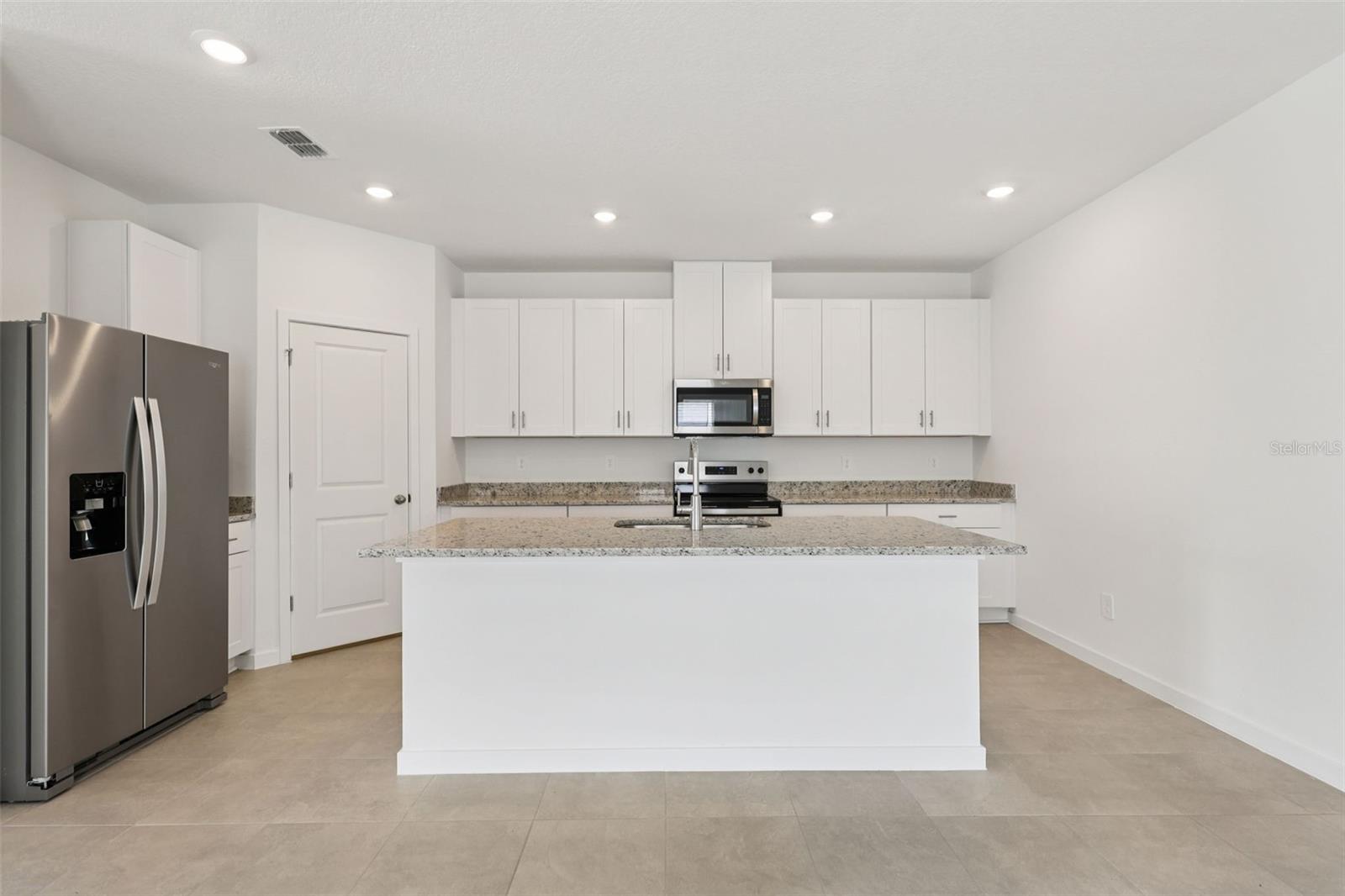 Photo is not of the actual home, but is an inspirational photo of builder’s model home and may depict options, furnishings, and/or decorator features that are not included. - 78 WANDERING CREEK WAY, PALM COAST