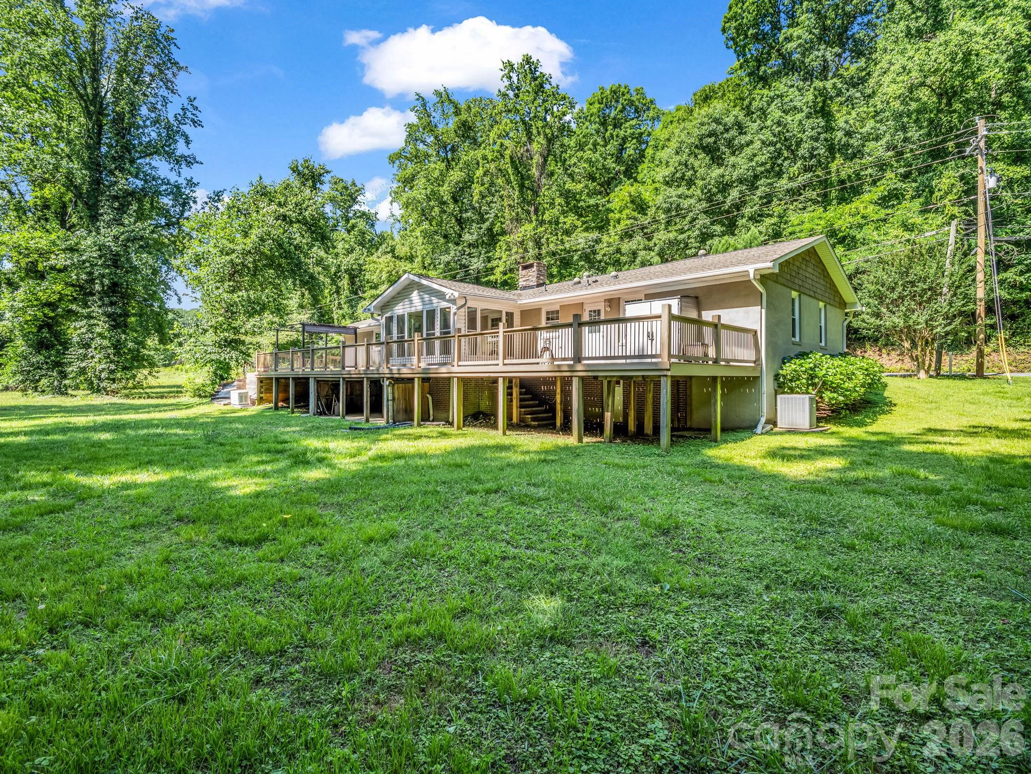 Wonderful back yard, that's waterfront and meanders along the water! - 260 Warrior Drive, Tryon