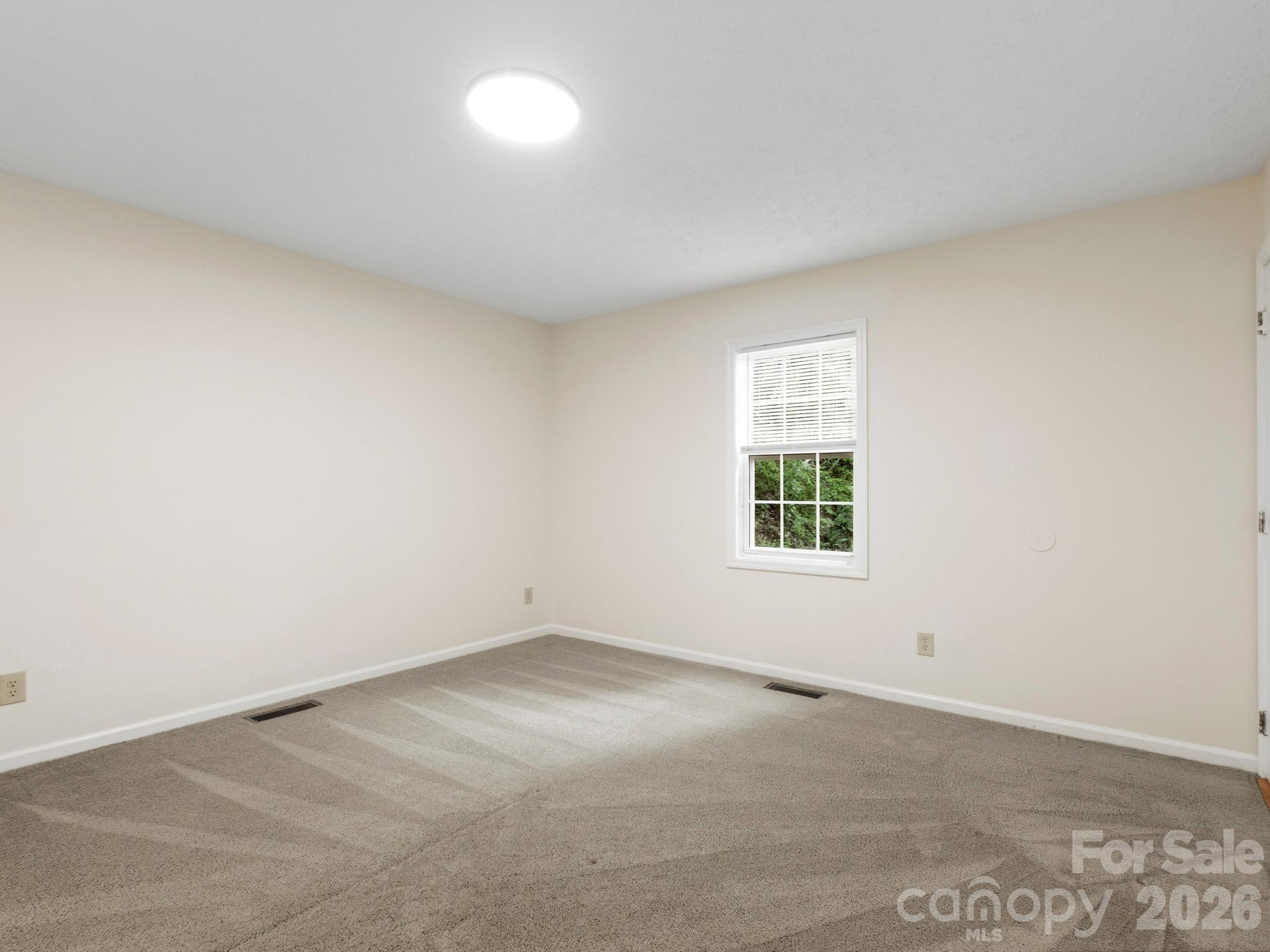Primary bedroom on main with en suite bathroom - 44 Leisure Mountain Road, Asheville