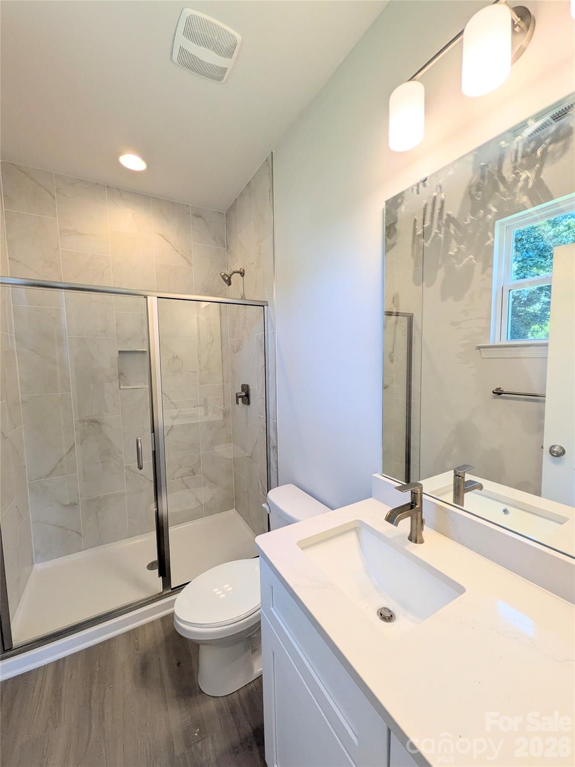Tiled shower in primary Bedroom - 209 James Street, Kannapolis