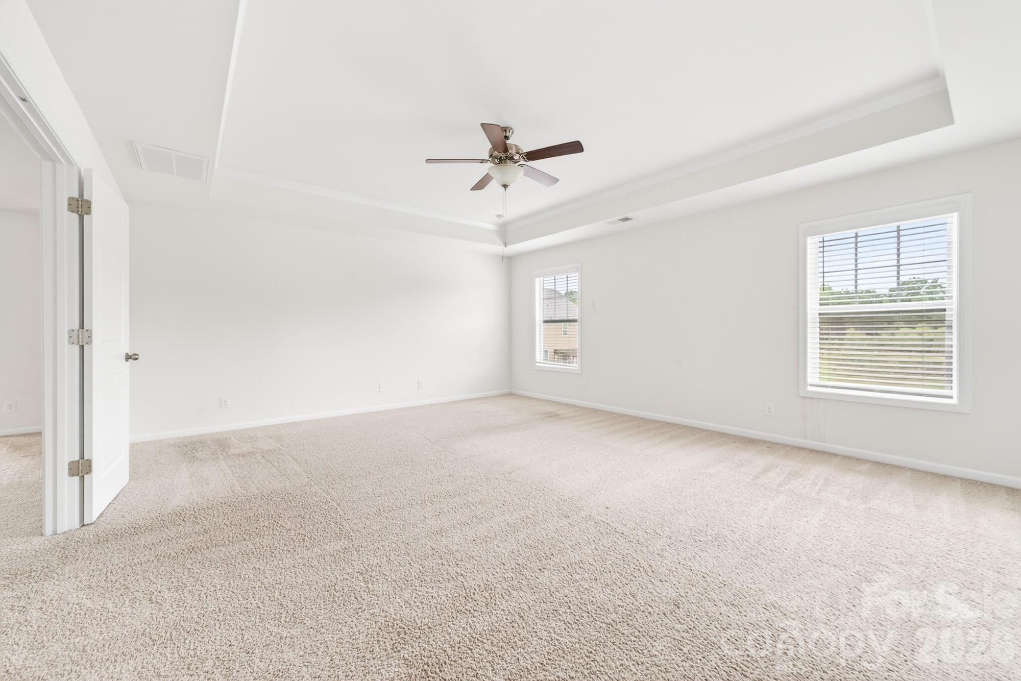 Primary bedroom on the second floor with double doors leading in - 5972 Redwood Pine Road, Concord