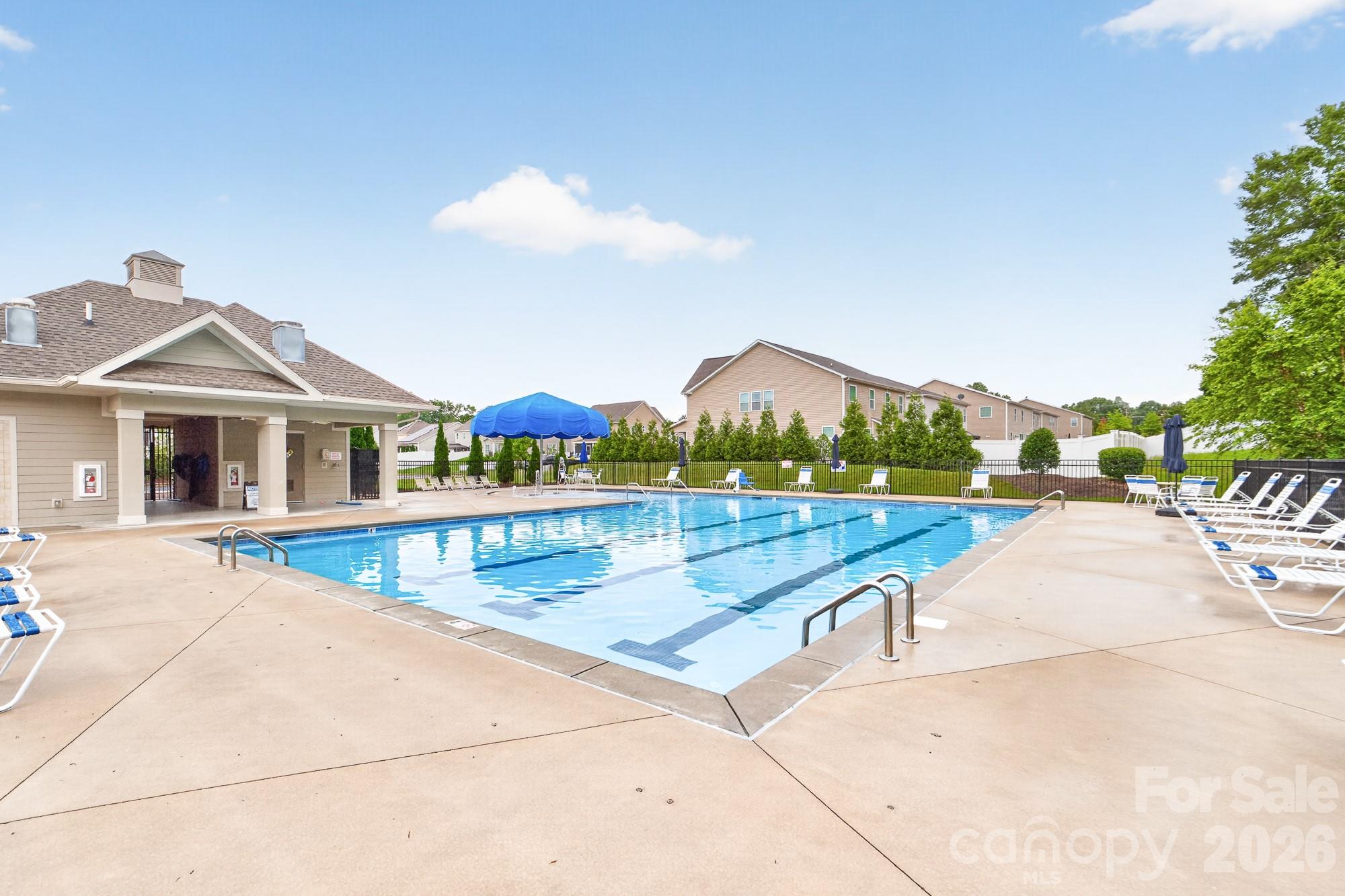 This inviting pool with chairs and umbrellas - 5972 Redwood Pine Road, Concord