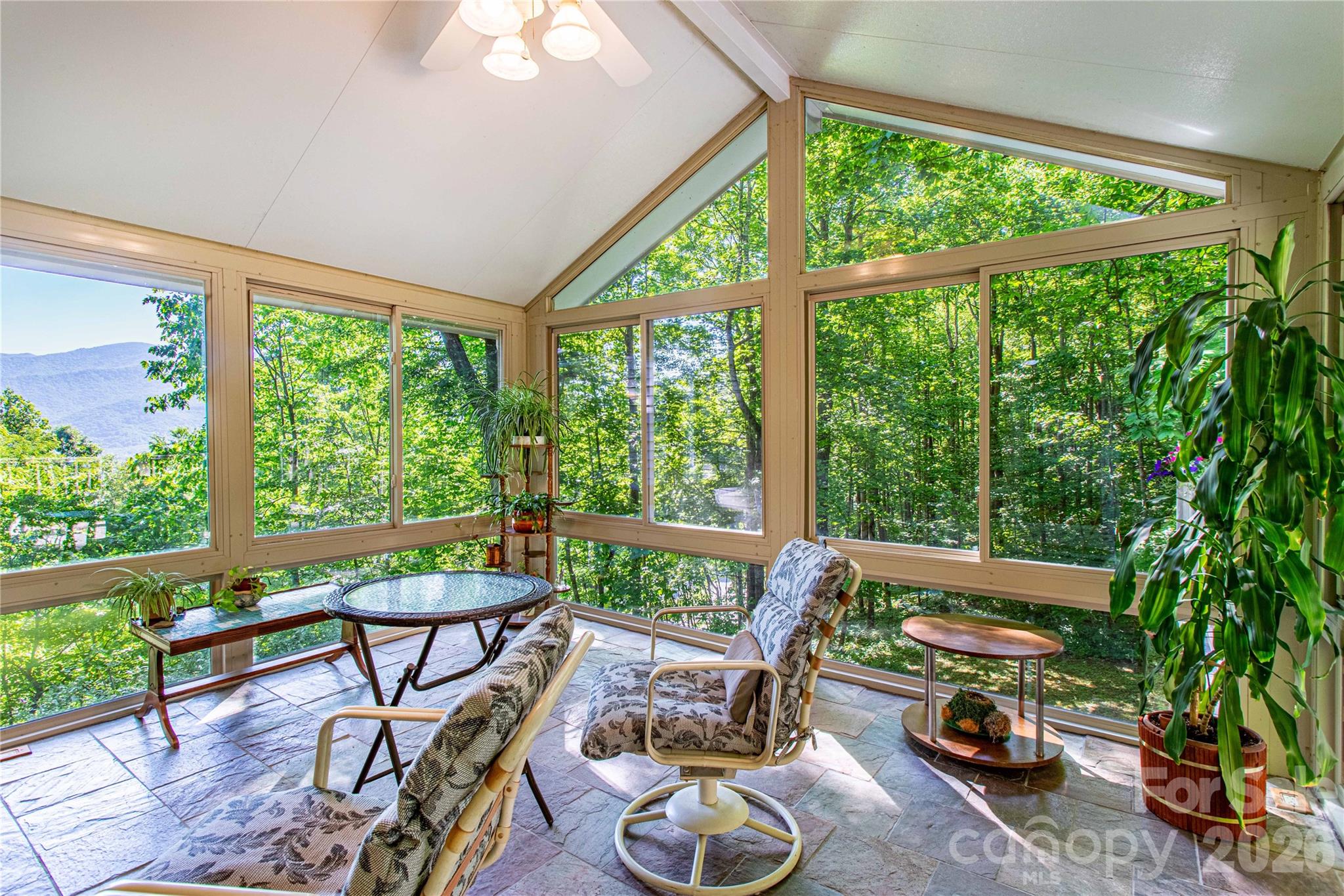 Imagine year-round having coffee or an afternoon beverage in your beautiful sunroom overlooking the mountains. - 22 Great Aspen Way, Black Mountain