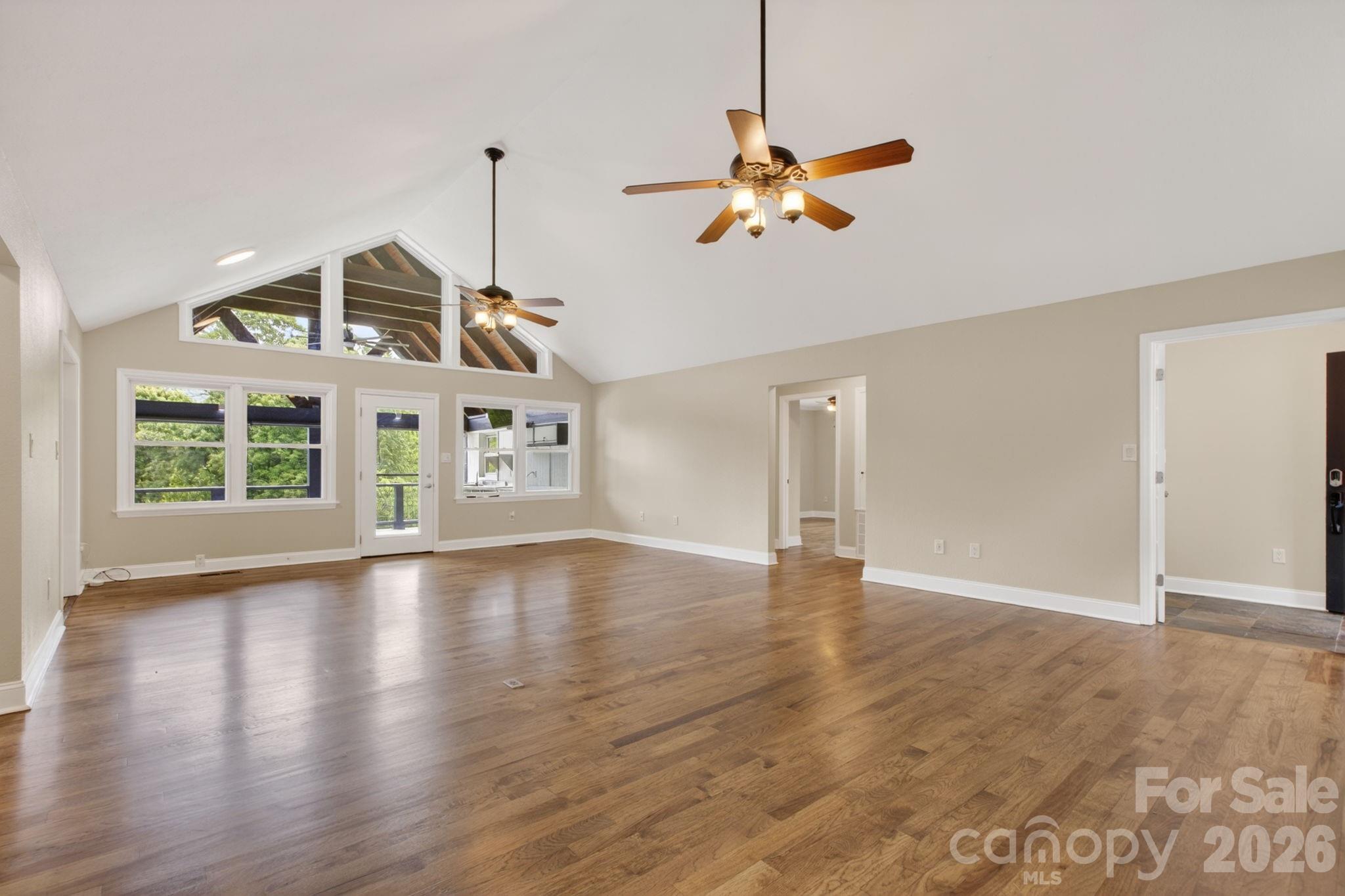 Open family room/dining area freshly finished hickory hardwood flooring - 97 Whippoorwill Lane, Fairview