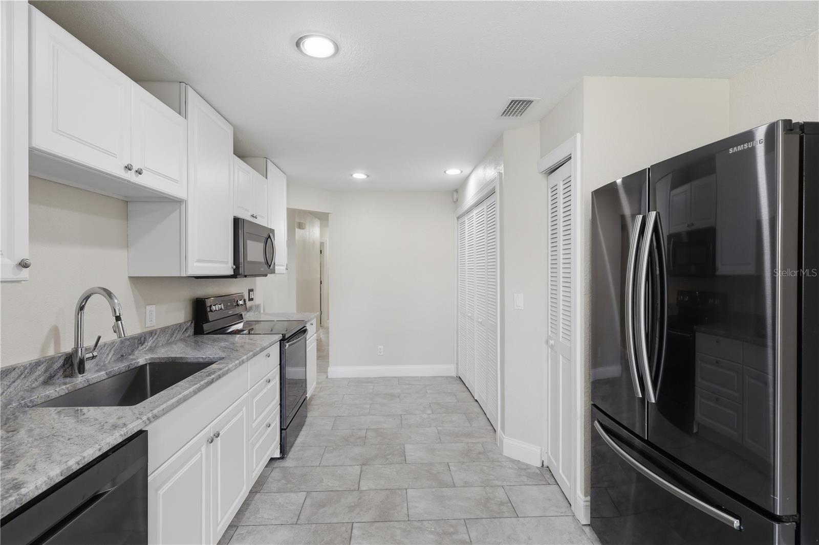 Updated kitchen with granite counters - 44 CAPTAINS WALK, PALM COAST