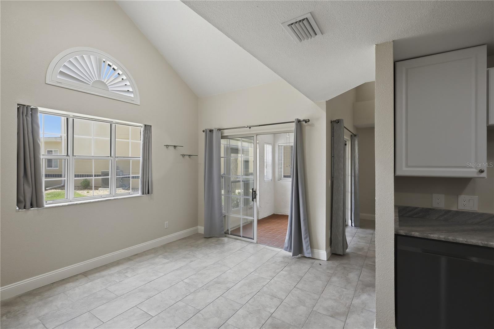 Breakfast area leading to the screened porch - 44 CAPTAINS WALK, PALM COAST