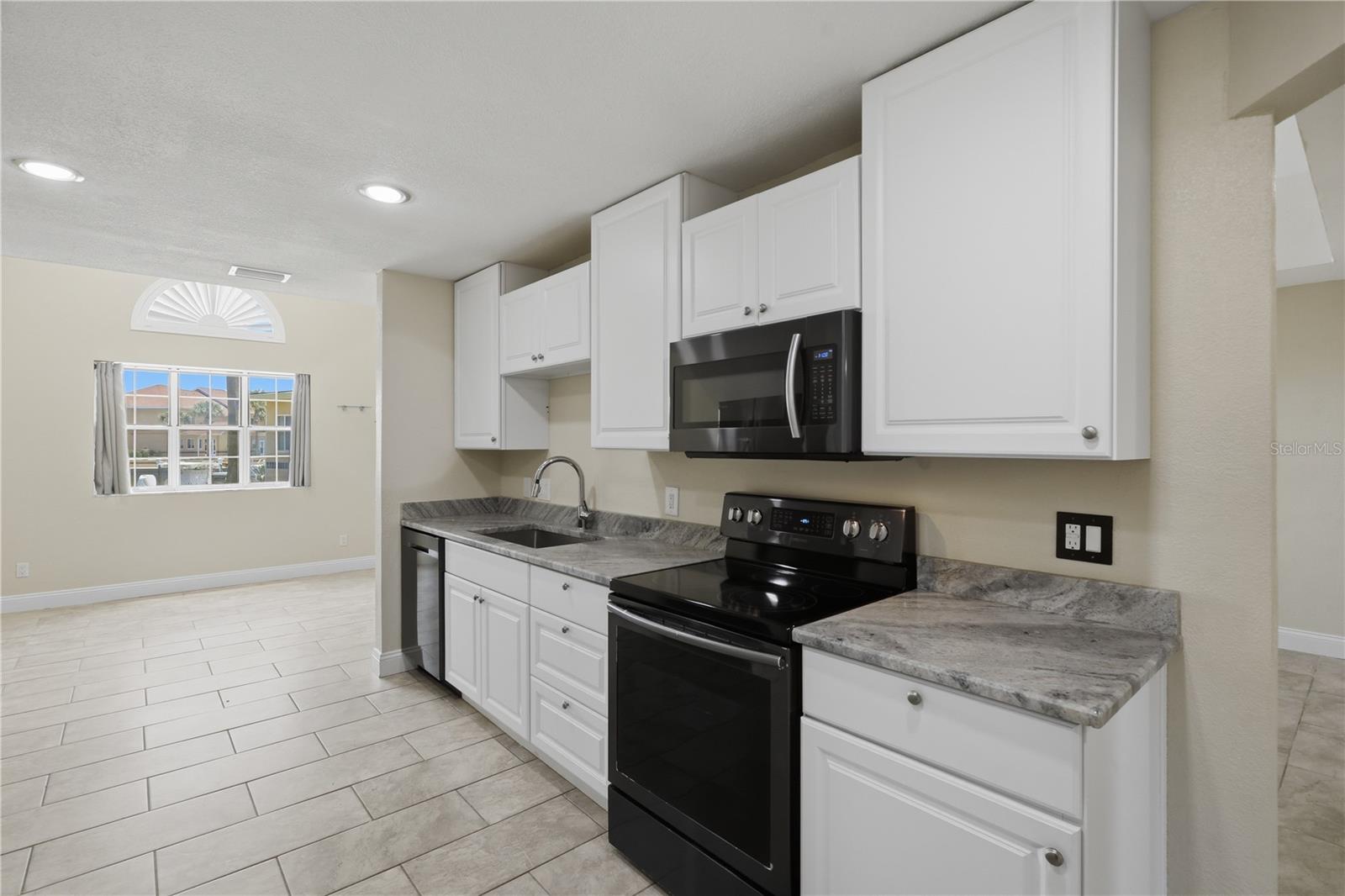Updated kitchen with granite counters - 44 CAPTAINS WALK, PALM COAST