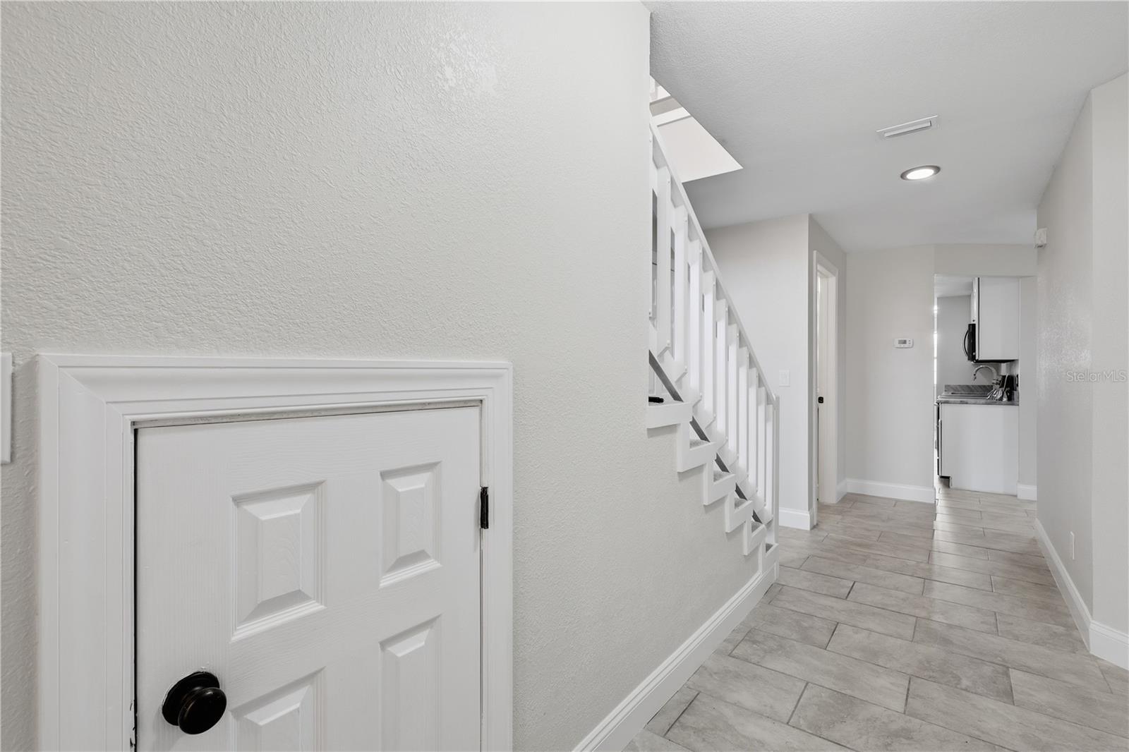 Hallway under stairs storage - 44 CAPTAINS WALK, PALM COAST