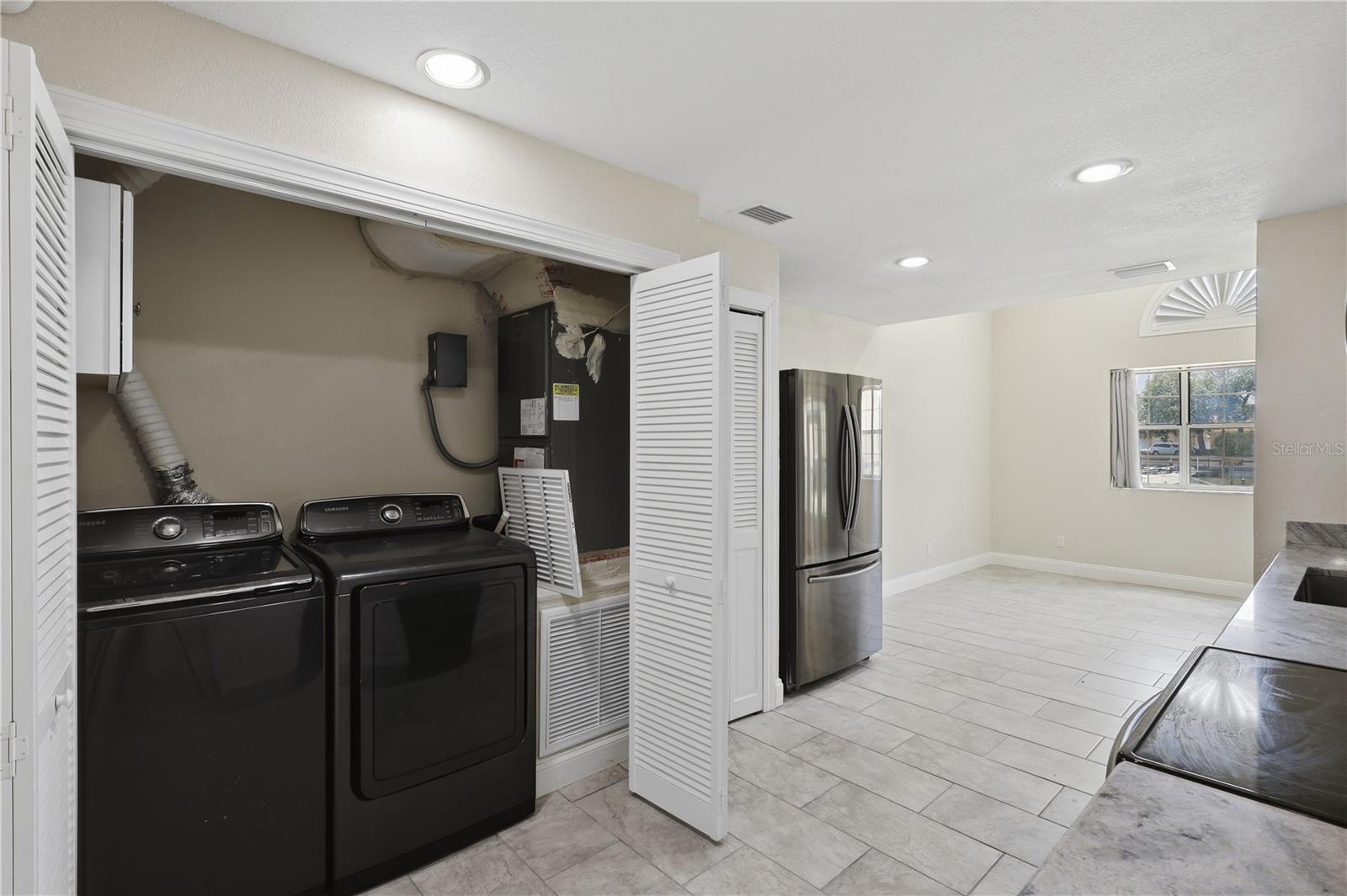 Washer and dryer conveniently located in the kitchen - 44 CAPTAINS WALK, PALM COAST