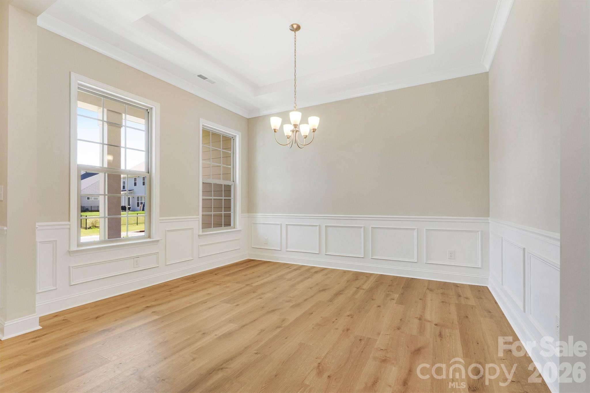 Inviting Flex Space just off the foyer is ready to serve whatever your needs may be: from Dining to Entertaining to Work or Relaxation... - 8091 Woodline Lane, Denver