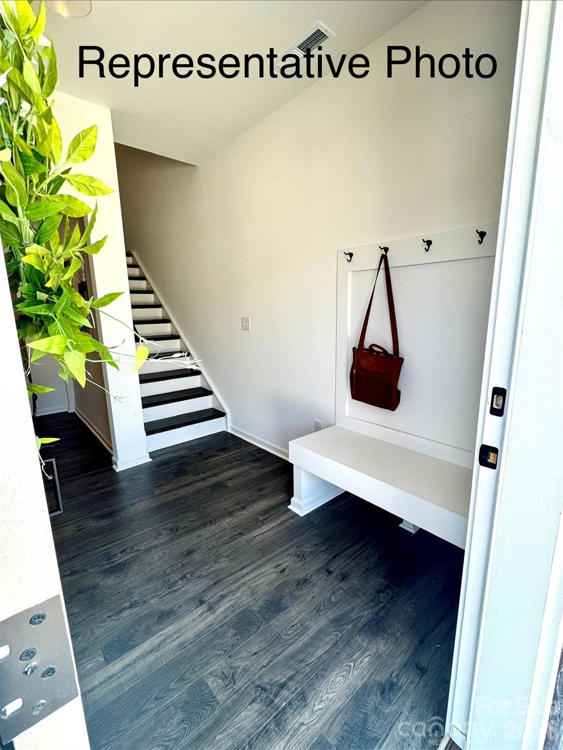 Foyer features included drop zone and hardwood staircase to 2nd floor - 407 Drawbar Drive, Clover