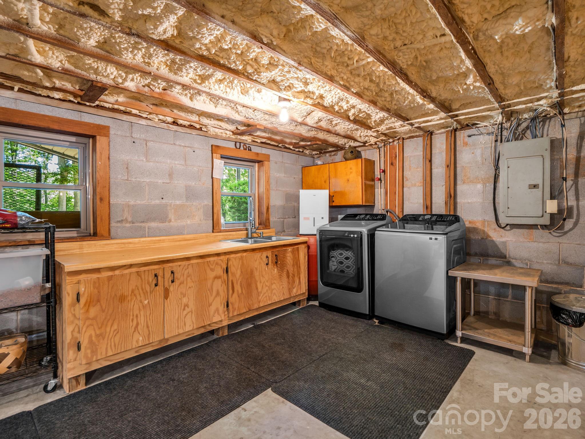 Unfinished area in the basement for expansion or storage! Along with laundry. - 670 Cedar Creek Road, Lake Lure