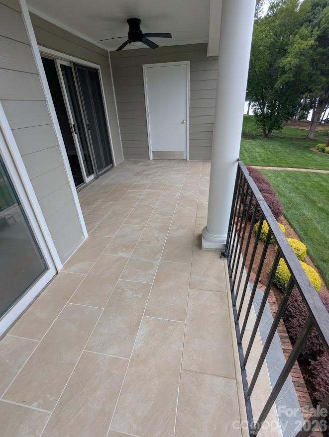 New tile on the covered porch. Relax and enjoy the view - 100 Northshore Court, Cherryville