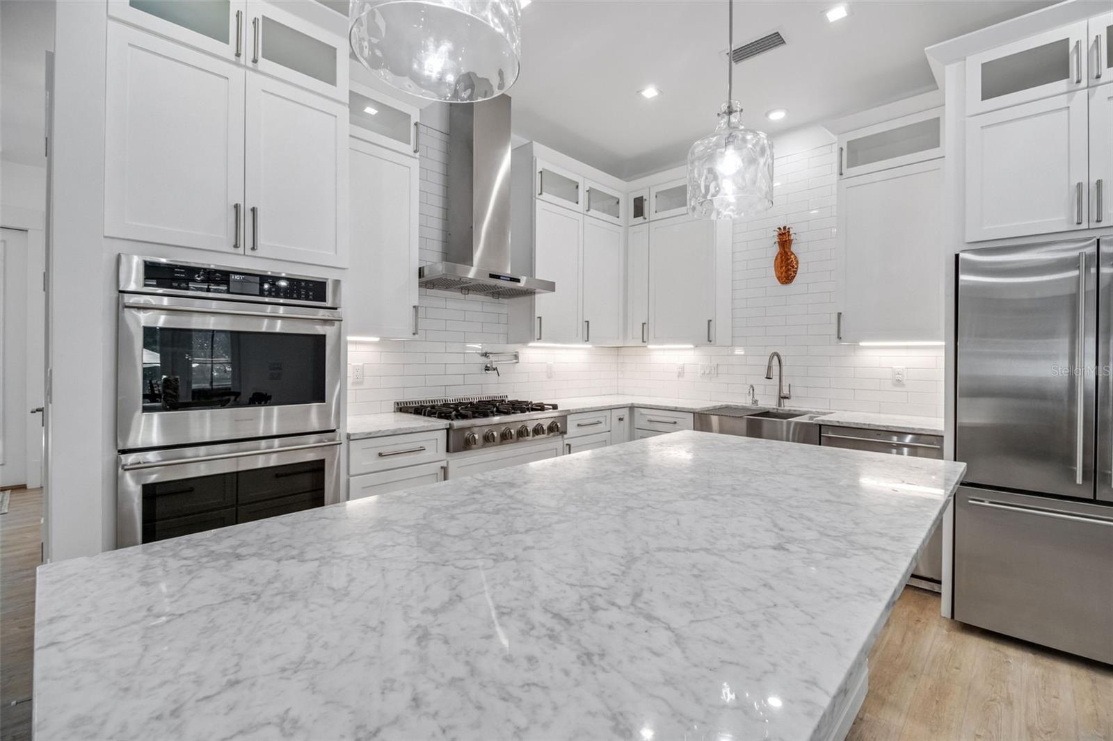 Chef-inspired kitchen featuring premium finishes and exceptional functionality - 14 MERIDIAN HOME LN, PALM COAST