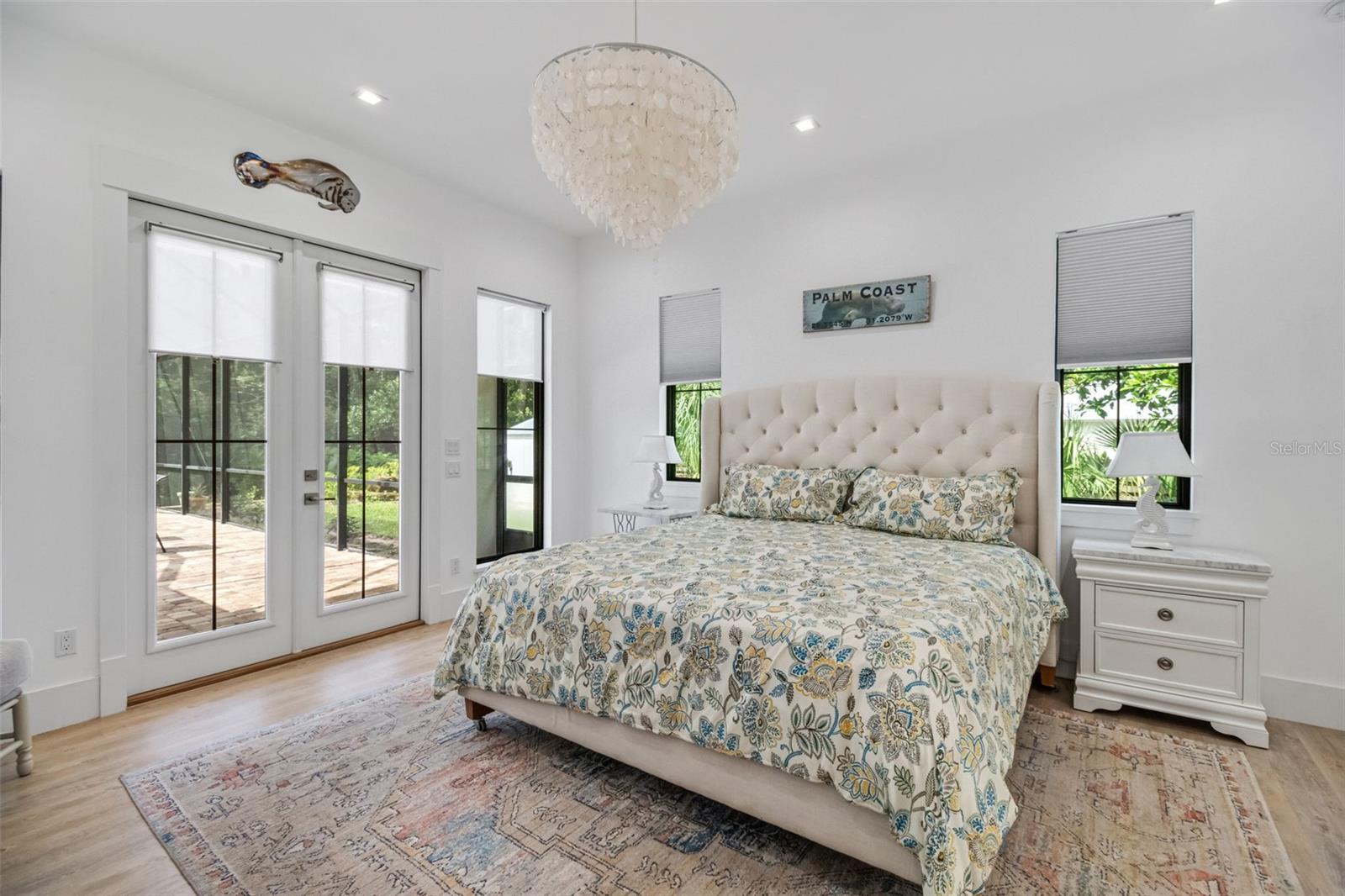 Private owner's retreat featuring elegant French doors that open directly to the pool and outdoor living area. - 14 MERIDIAN HOME LN, PALM COAST