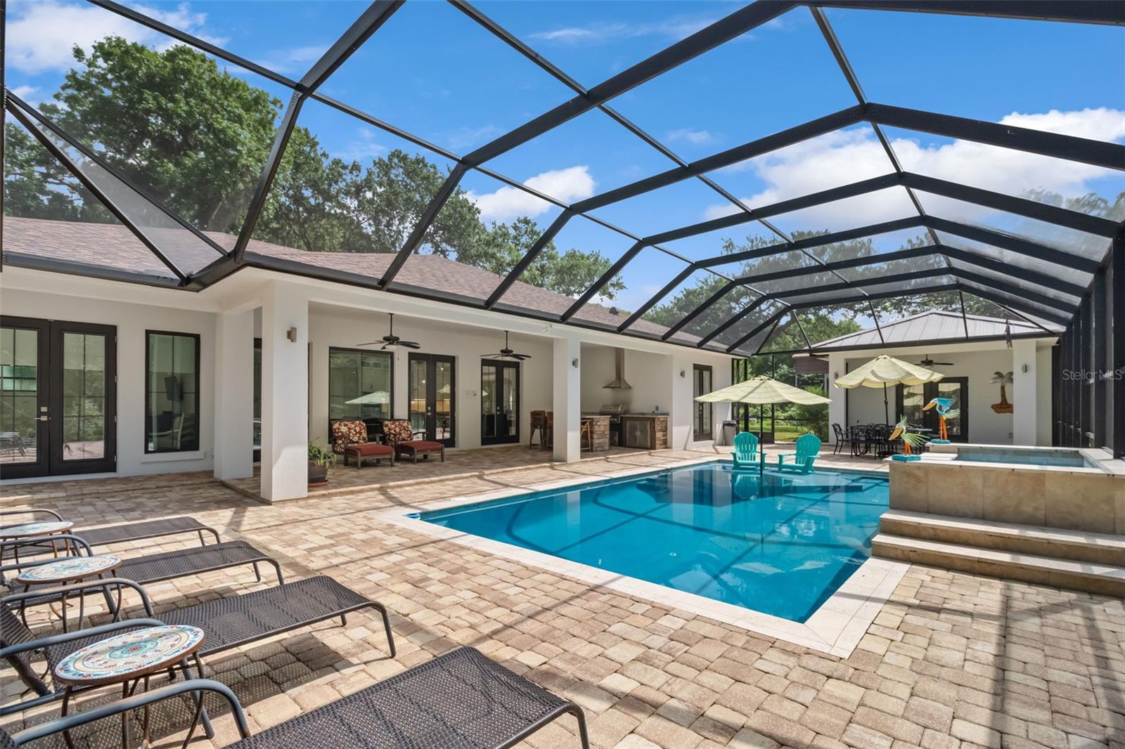 Outside paradise awaits with built in grilling station, refrigerators, sink and storage. - 14 MERIDIAN HOME LN, PALM COAST