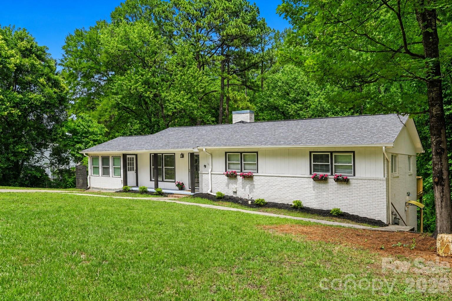 Set on over half an acre in Beverly Hills, this home offers space, privacy, and curb appeal. - 716 Grandview Drive NE, Concord
