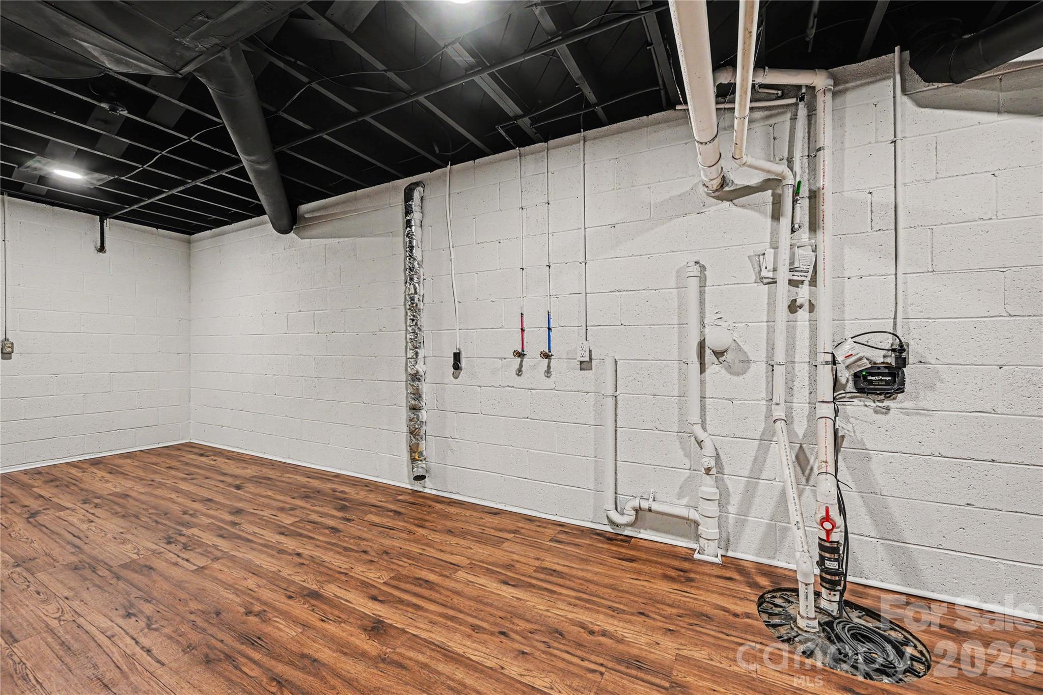 Dedicated laundry and utility area conveniently located within the expansive lower level. - 716 Grandview Drive NE, Concord