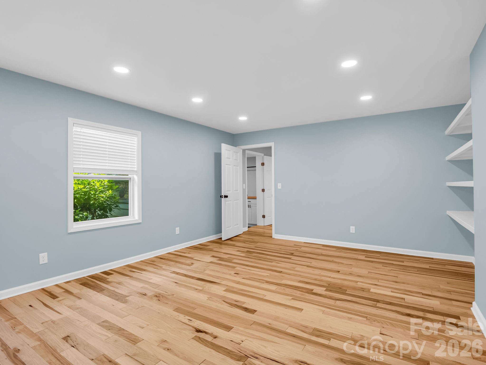 Dedicated office/private den off of the primary bedroom with door to back yard - 35 Chastain Hill Road, Mills River