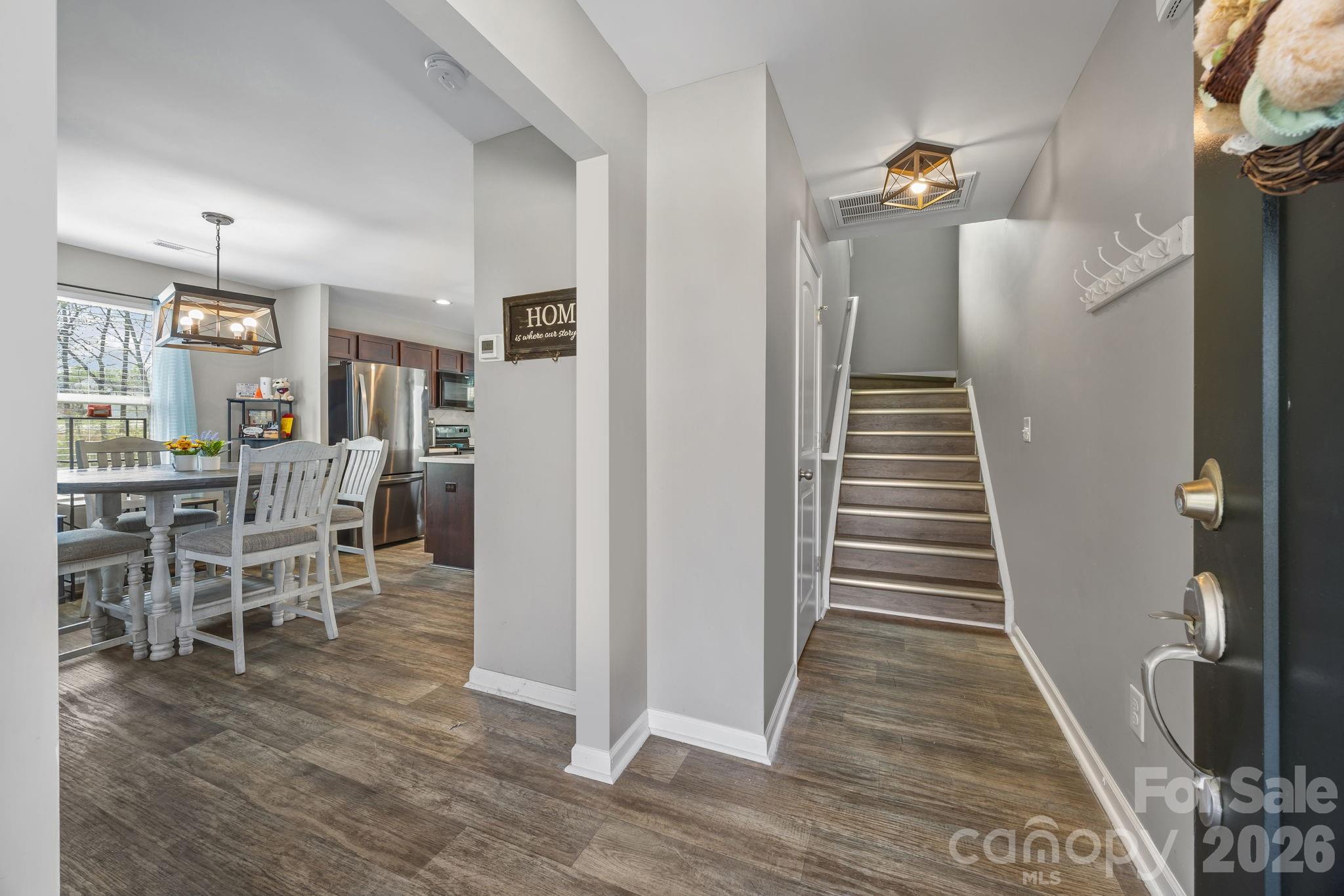 Come on in! LVP floors flow throughout the main living area and up the steps - 813 Yorkshire Drive, Albemarle