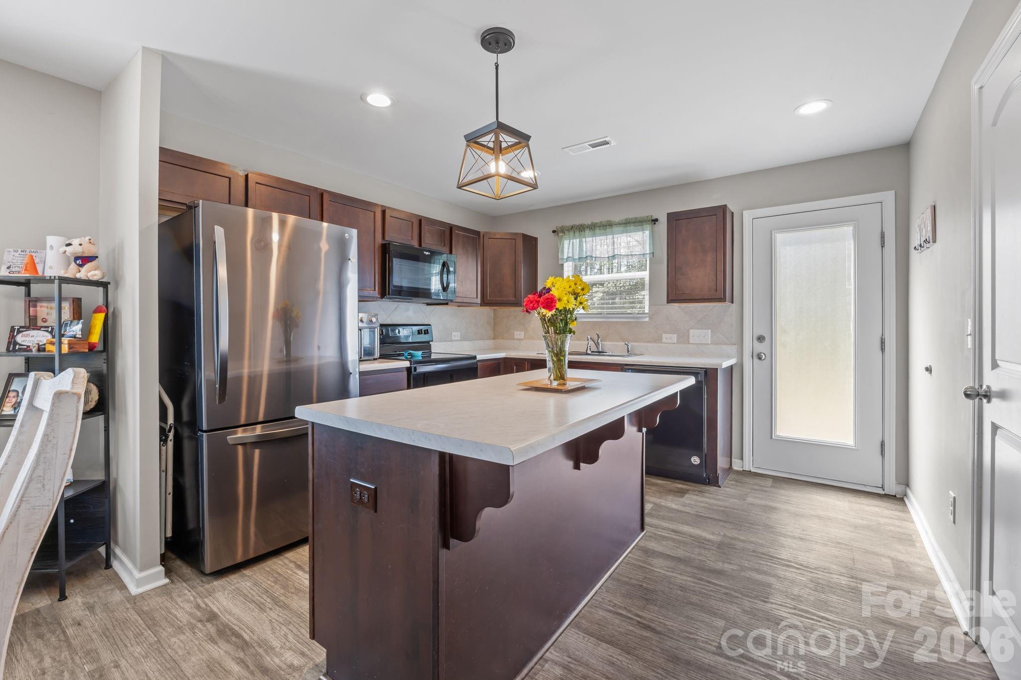 Open layout with a modern kitchen, a dining area and living room that flow together - 813 Yorkshire Drive, Albemarle