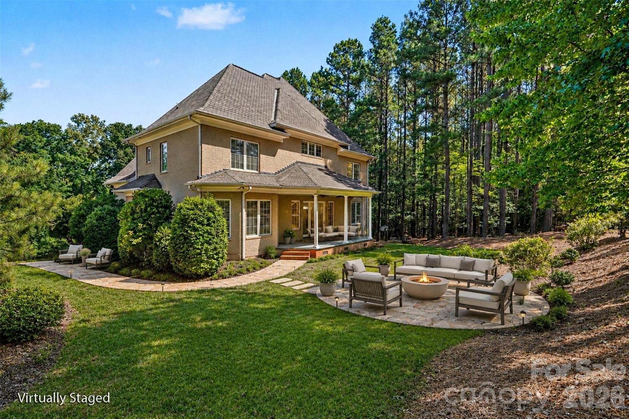 Backyard view with digitally staged fireplace - 5129 Watermead Lane, Belmont