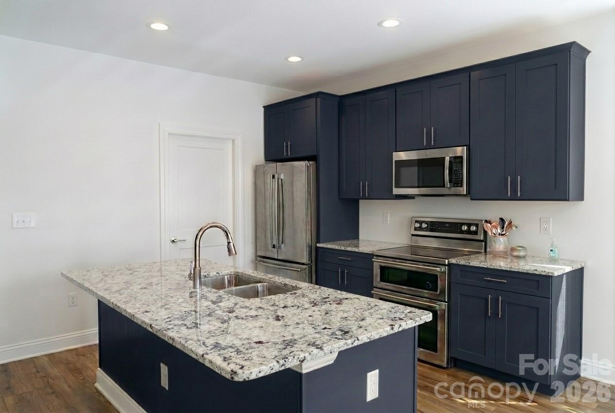 Kitchen rendering showing lots of cabinetry and granite countertops - 323 Mingus Street, Canton