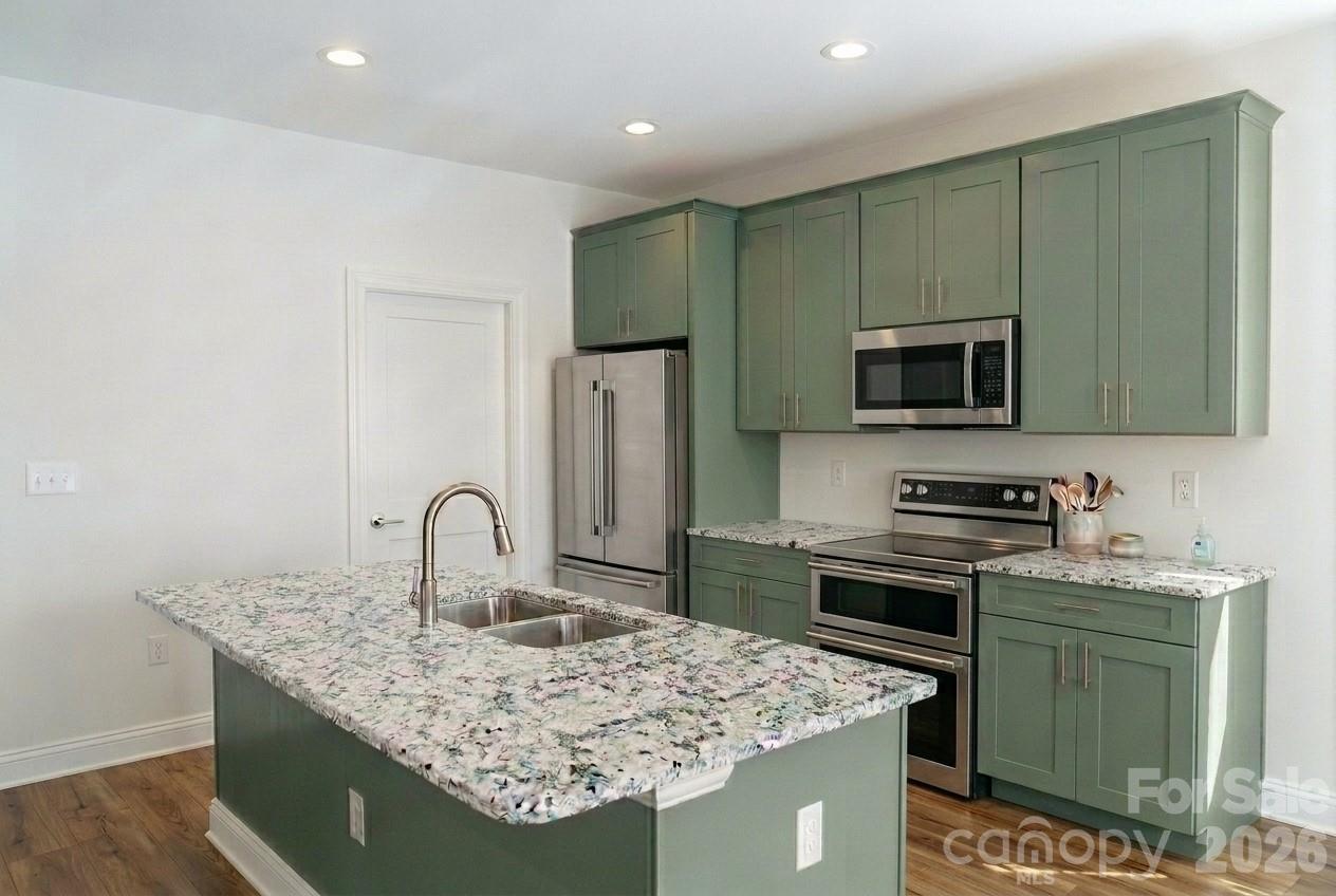 Well equipt kitchen rendering with lots of cabinets and granite countertops - 315 Mingus Street, Canton
