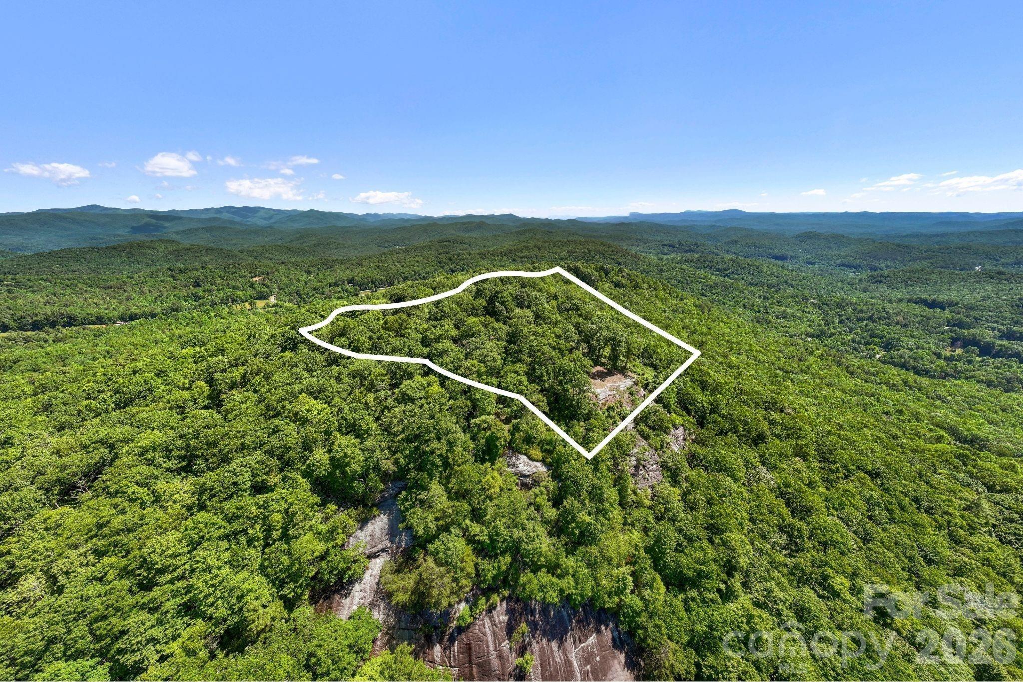 Approximate boundary overlay highlights the property's unique ridgeline setting and relationship to the surrounding terrain and views. - 9999 Rocky Mountain Road, Lake Toxaway