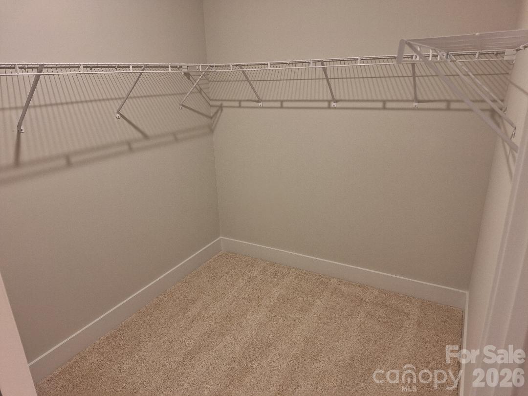 Primary Bedroom Walk-In Closet - 140 Kerr Walk Drive, Statesville