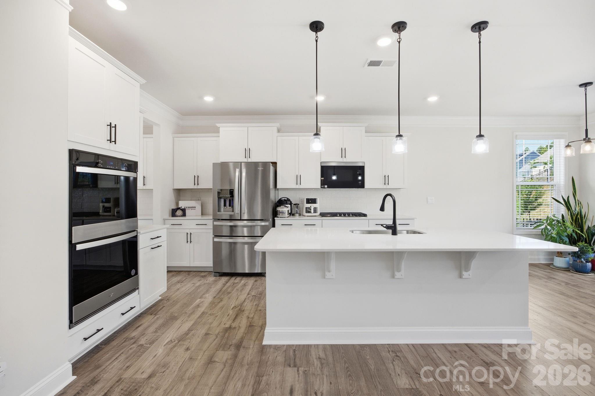 Gourmet Kitchen with double ovens and quartz counters - 125 Saidin Lane, Troutman