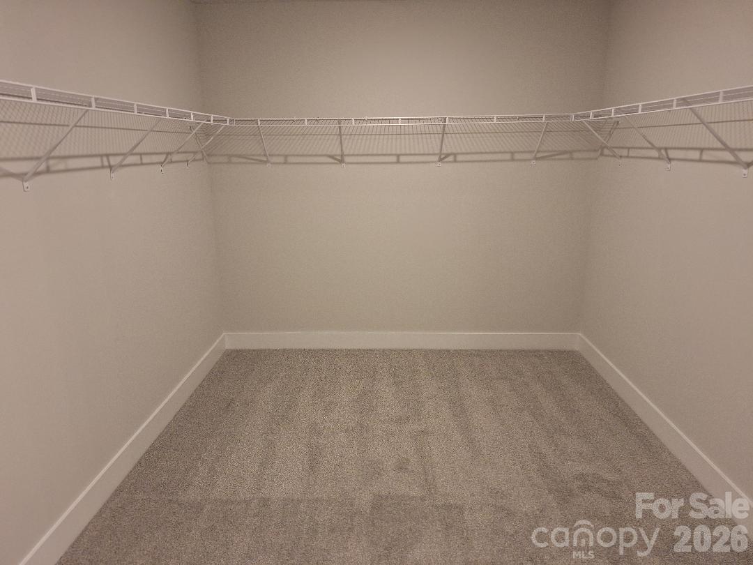 Primary Bedroom Walk-In Closet - 152 Kerr Walk Drive, Statesville