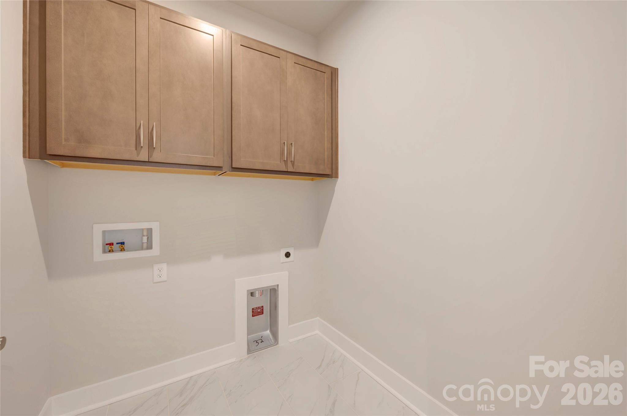 Laundry room with upper cabinets - 316 Ardmore Drive, Belmont