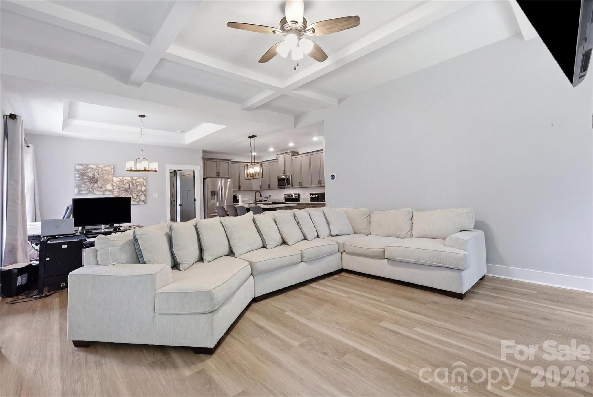 Custom millwork. The coffered and tray ceiling add true architectural personality to the open floorplan. 9-foot ceilings span the first floor. - 1298 Cole Avenue, Rock Hill