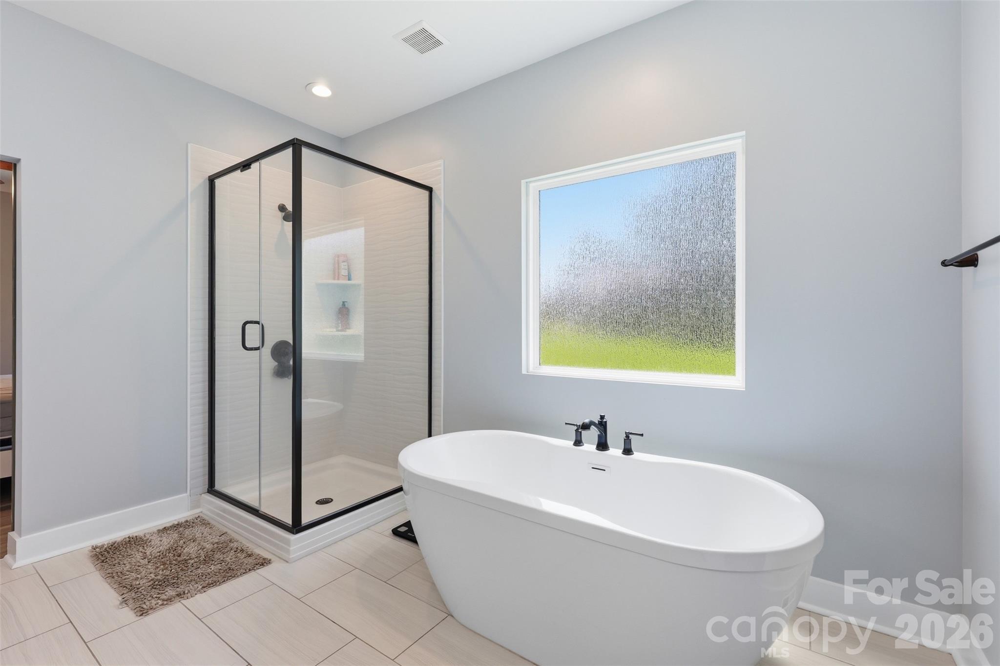 Standalone shower and tub in the primary bathroom - 1298 Cole Avenue, Rock Hill