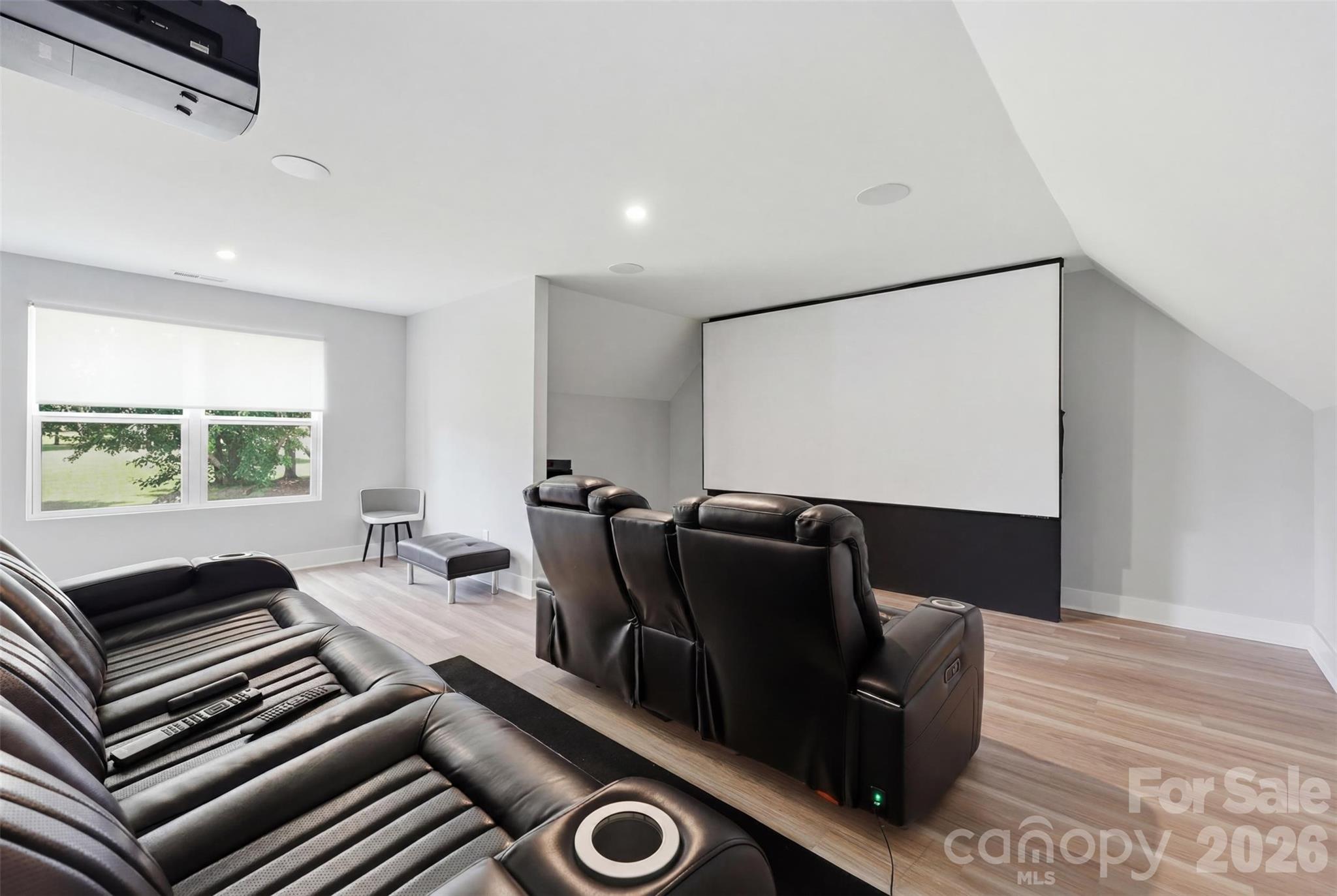 BEN Q projector, Dolby Atmos system, and sound transparent screen, and cinema seating makes movie watching a remarkable experience - 1298 Cole Avenue, Rock Hill