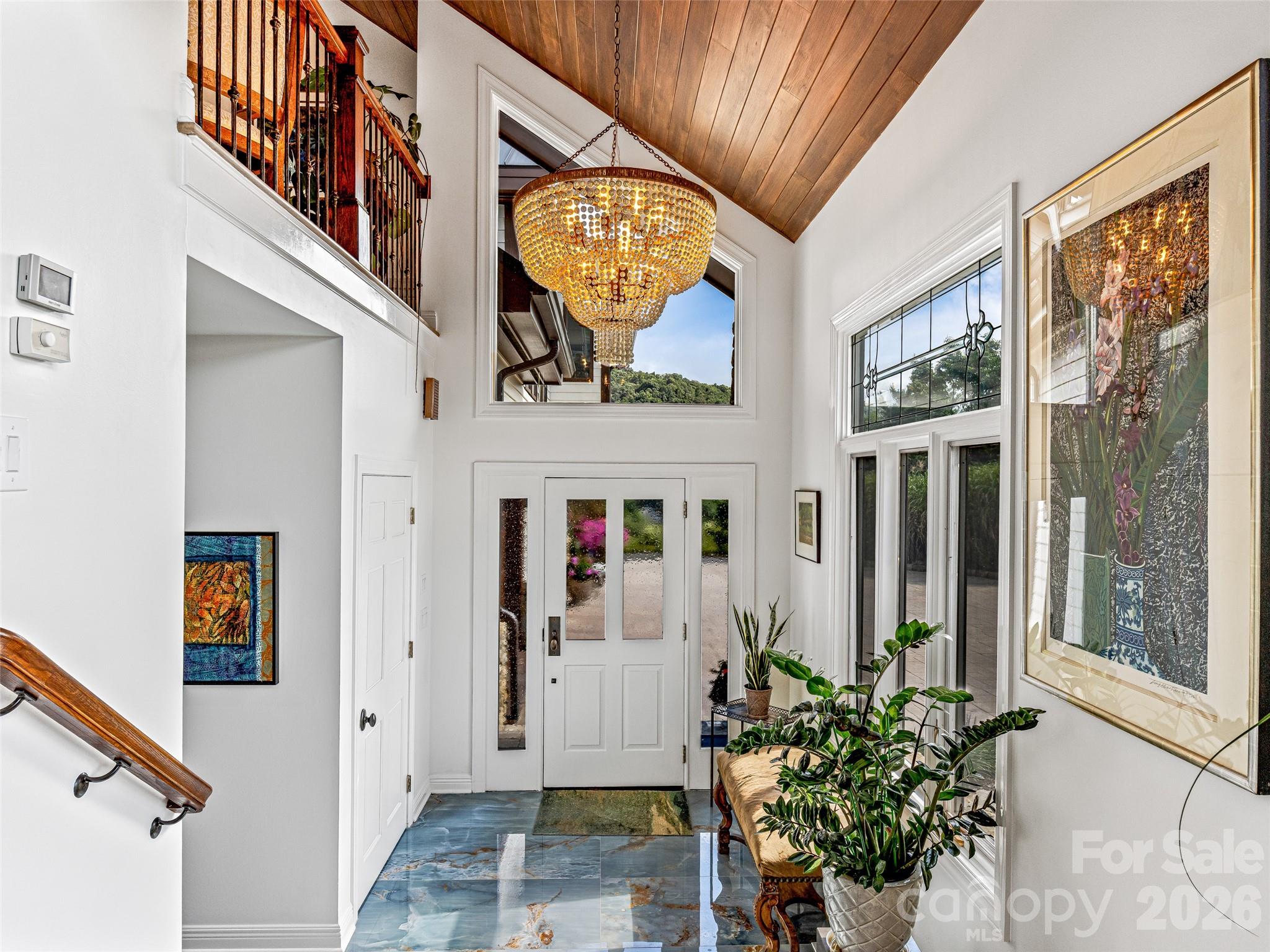 Vita Bella polished porcelain floors greet you as you enter the home; blends perfectly with the sky. - 10 Beaverbrook Court, Asheville