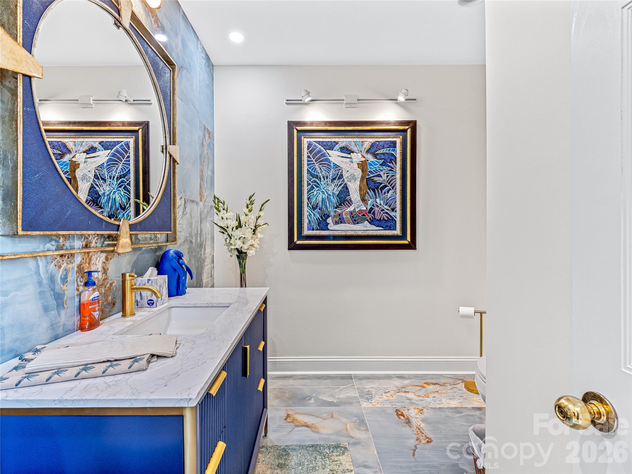 Powder room with Vita Bella polished porcelain floors - 10 Beaverbrook Court, Asheville