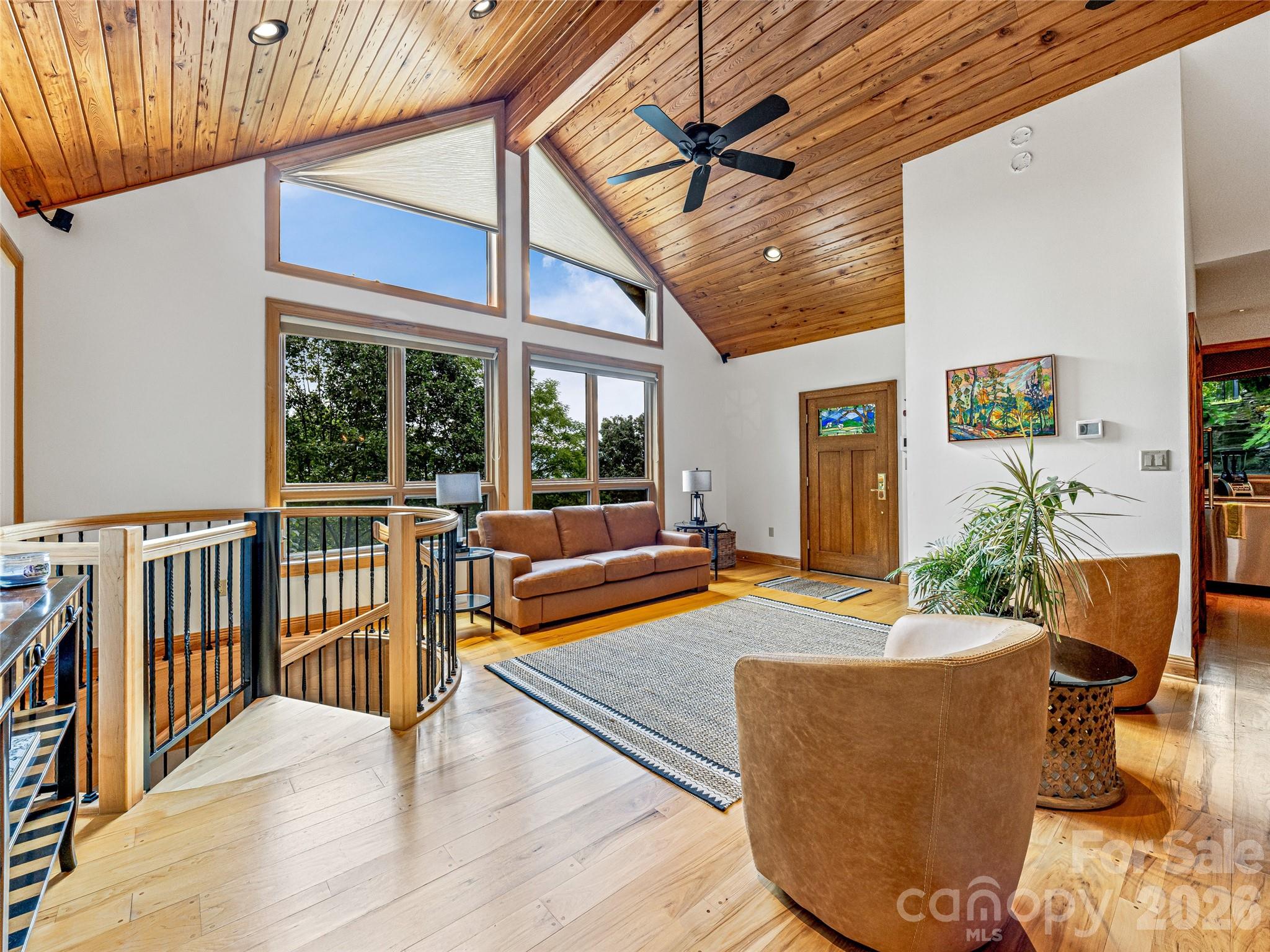 Guest house living room with vaulted ceilings, full kitchen and access to covered back porch - 10 Beaverbrook Court, Asheville