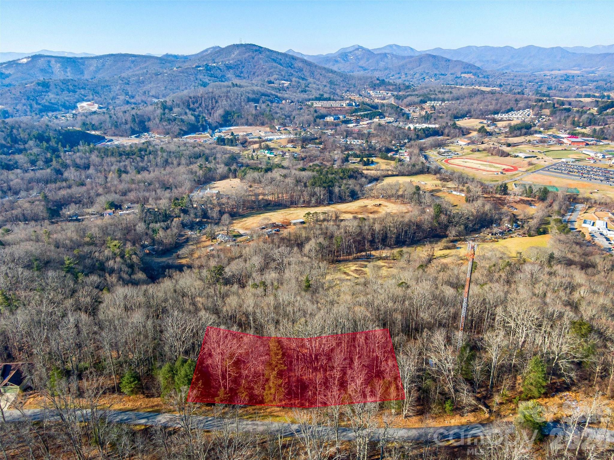 Priced aggressively at just $60,000, this gently sloping homesite presents a rare opportunity to build in one of Asheville’s premier gated mountain communities without the premium price tag. - 92 Chimney Crest Drive, Asheville