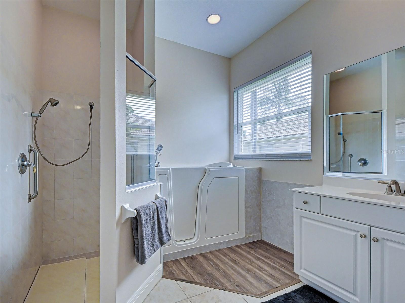 Primary Bathroom has Separate Walk in Shower and Tub - 5017 BELLA TERRA DR, VENICE