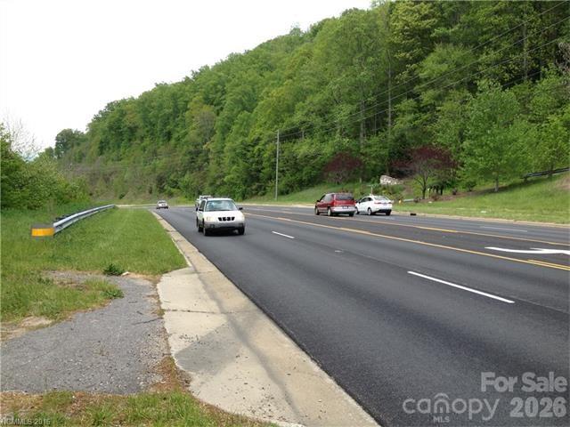 View of site clearance toward Ahseville from one of two entrances with center lane for ease of access. - 10 acres Charlotte Highway, Asheville
